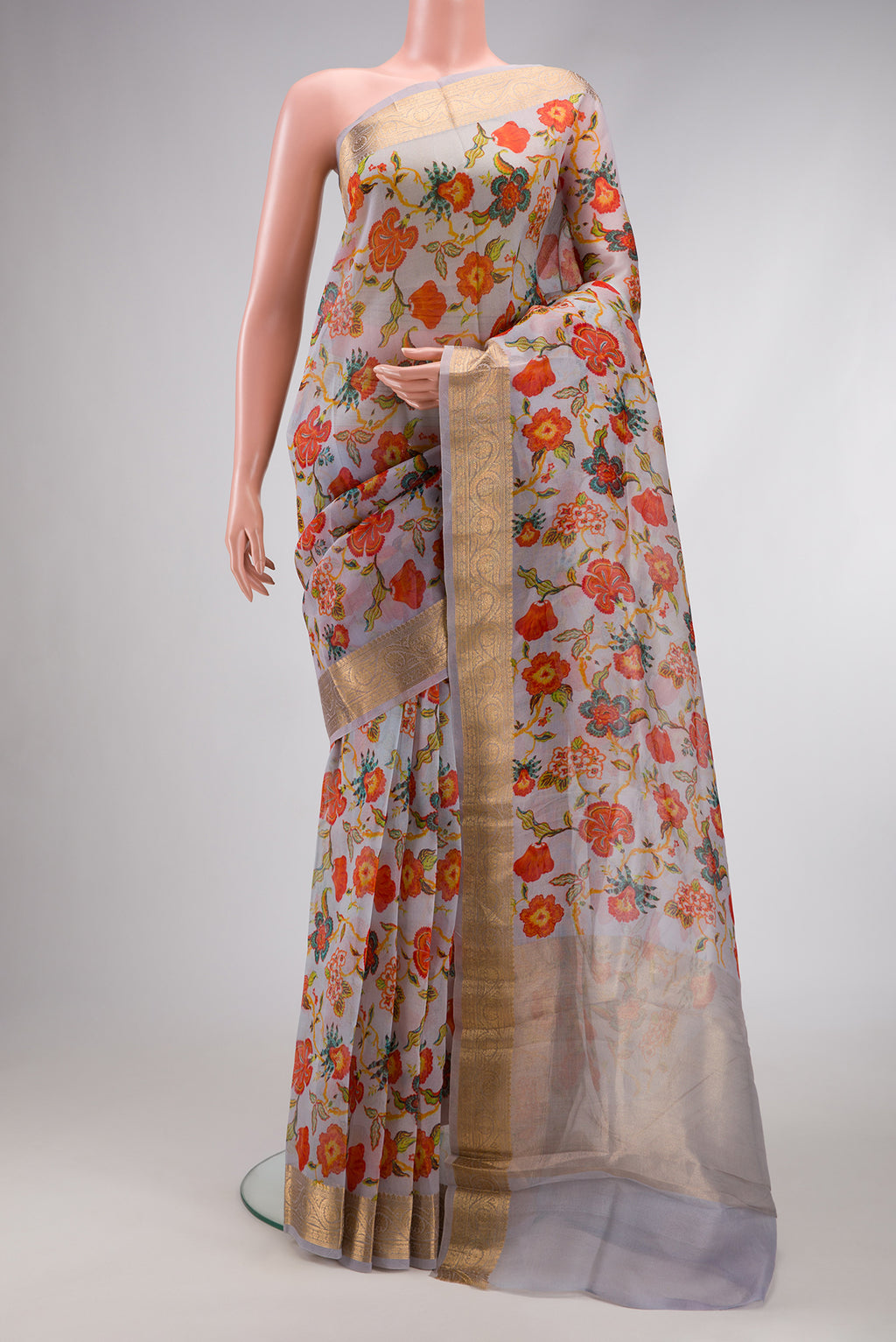 Grey Dual Tone Organza Silk Saree with Printed design on the body and Zari Border.  displayed on a mannequin