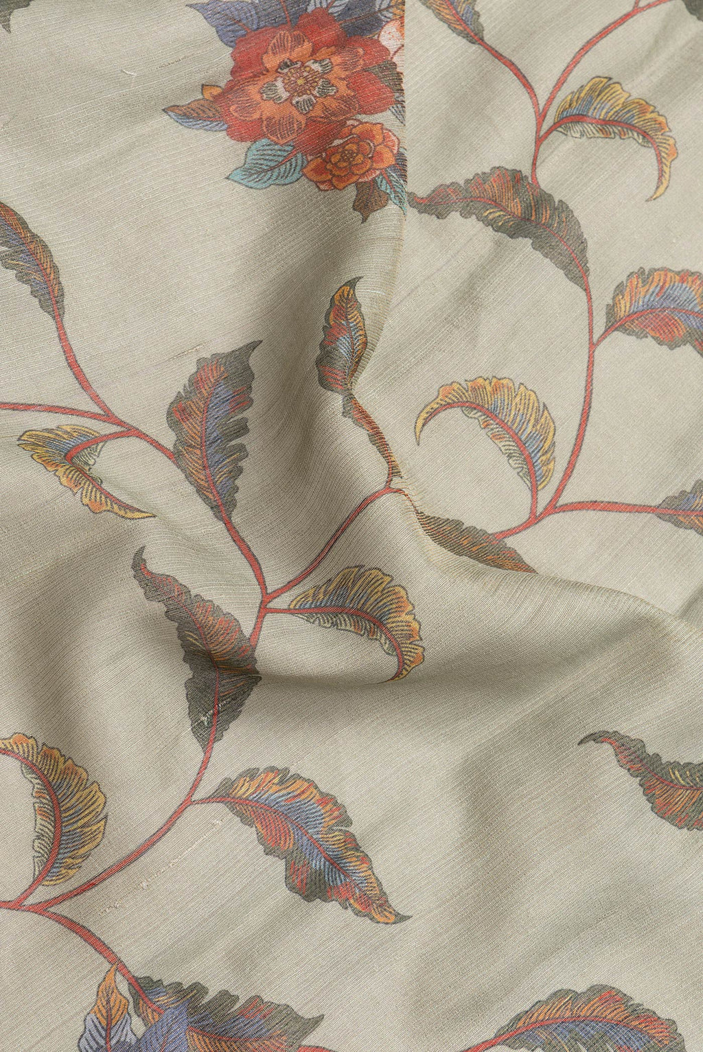 Close up of Pista Green Dual Tone Tussar Silk Saree with Printed design on the body and Thread Border.  displaying folds