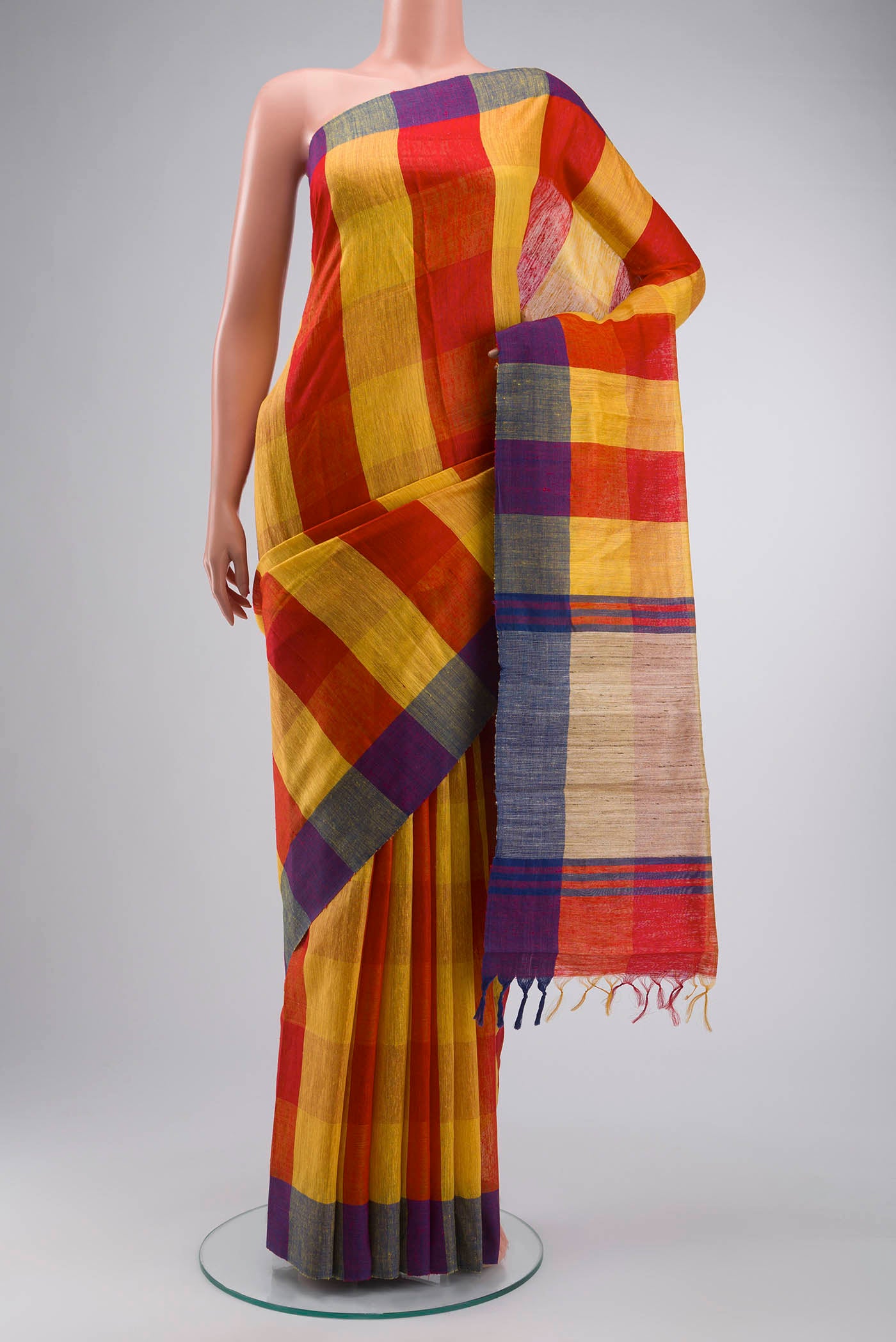 Multi Color Tussar Silk Saree with Checked design on the body and Checks Border displayed on a mannequin