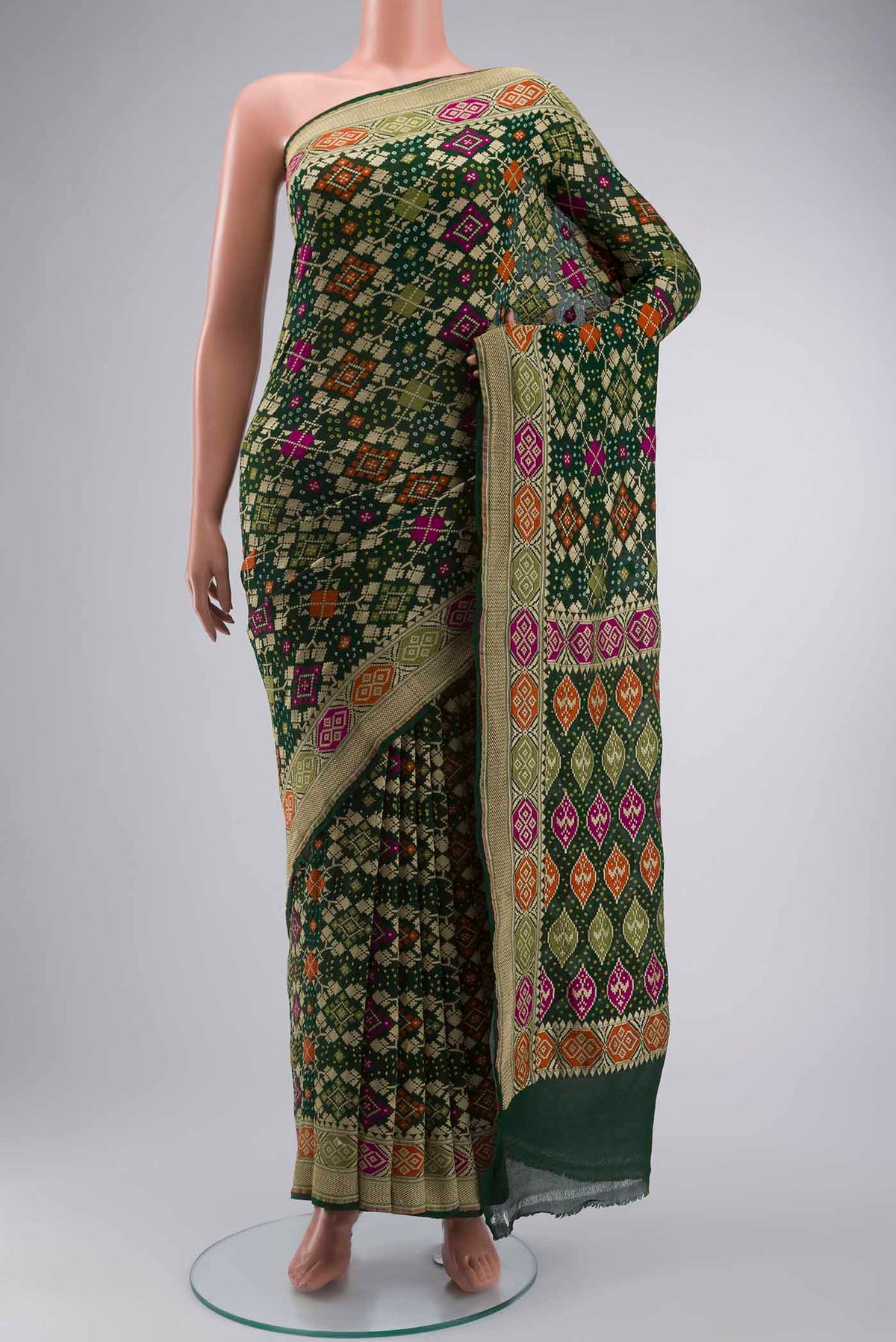 Green Banarasi Georgette Saree with Bandhani Print on the body and Zari Border displayed on a mannequin