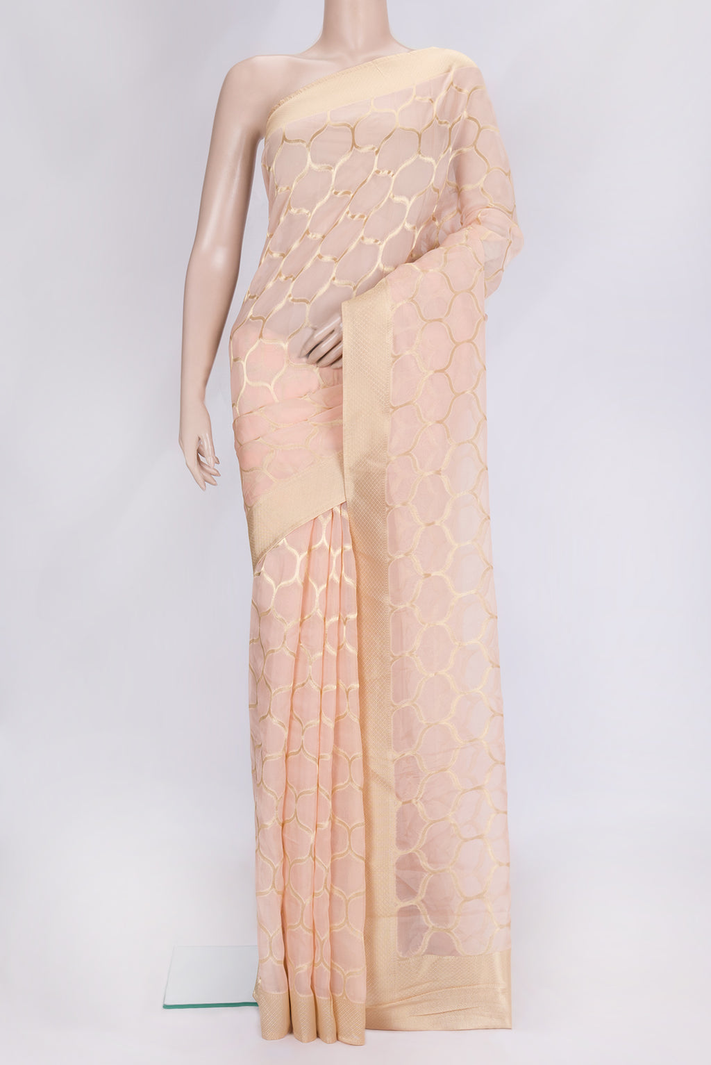 Peach Dual Tone Organza Silk Saree with Zari Brocade on the body and Zari Border.  displayed on a mannequin