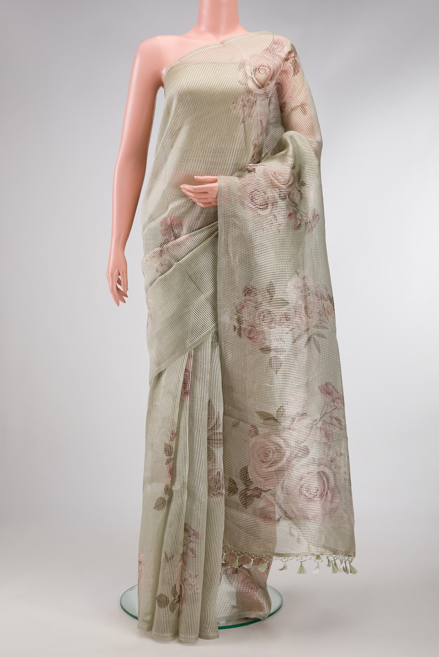 Light Green Dual Tone Organza Silk Saree with Printed design on the body and Without Border.  displayed on a mannequin
