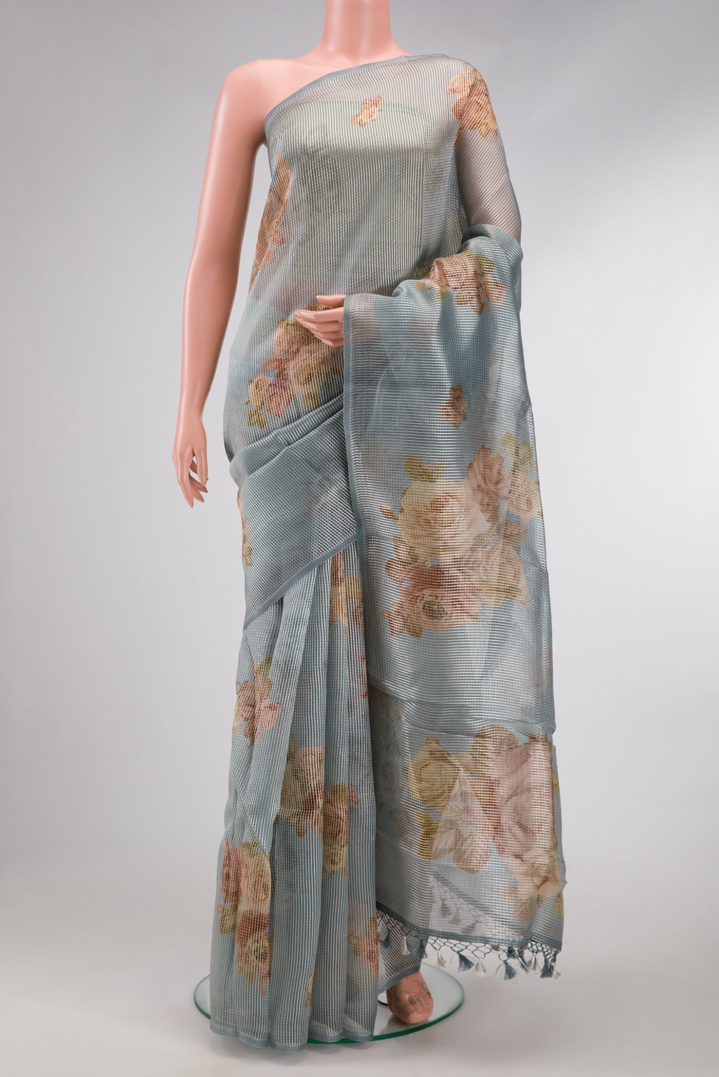 Grey Dual Tone Organza Silk Saree with Printed design on the body and Without Border.  displayed on a mannequin
