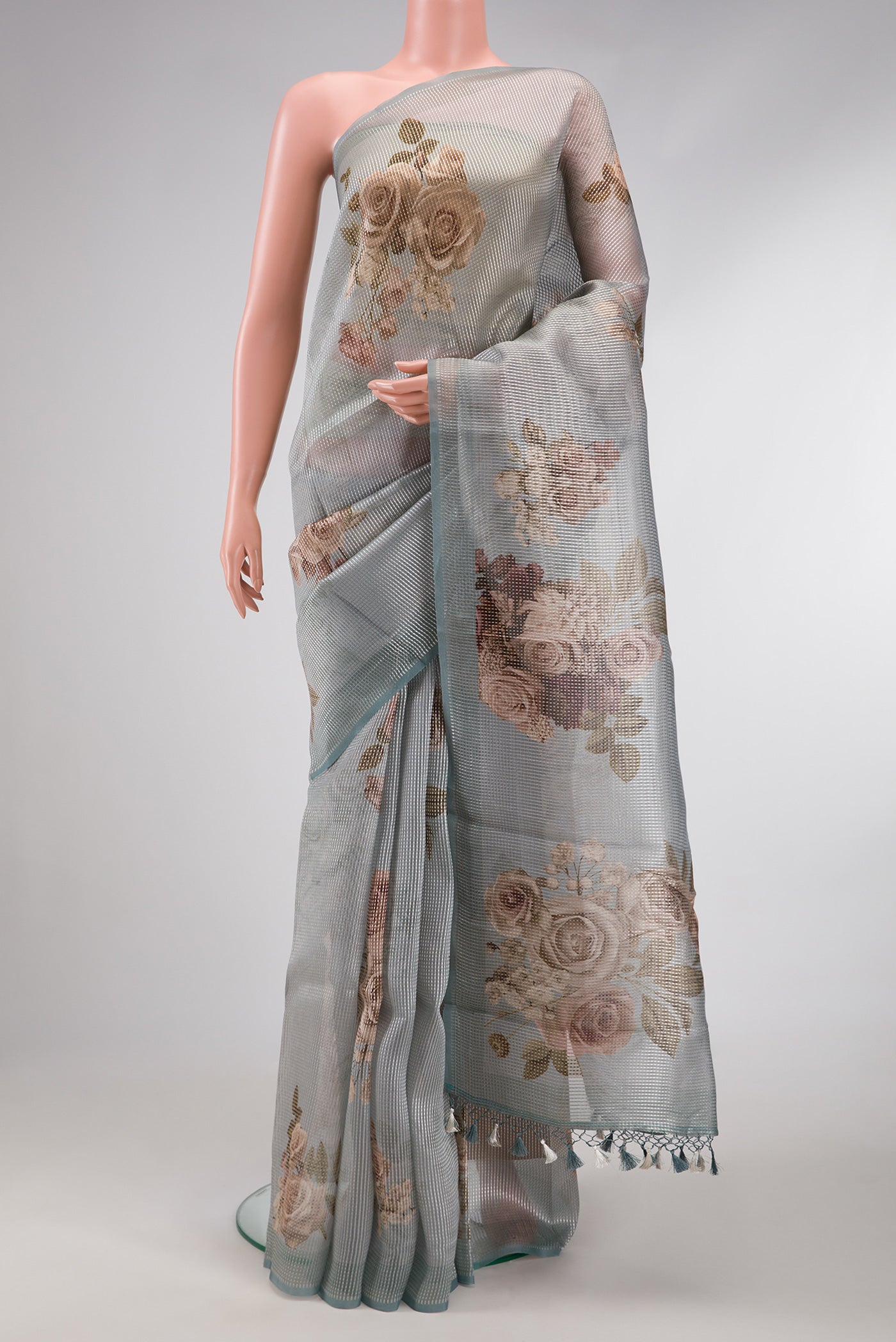 Grey Dual Tone Organza Silk Saree with Printed design on the body and Without Border.  displayed on a mannequin