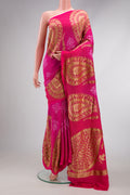 Pink Dual Tone Bandhani Silk Saree with Bandhani Print on the body and Fancy Border.  displayed on a mannequin