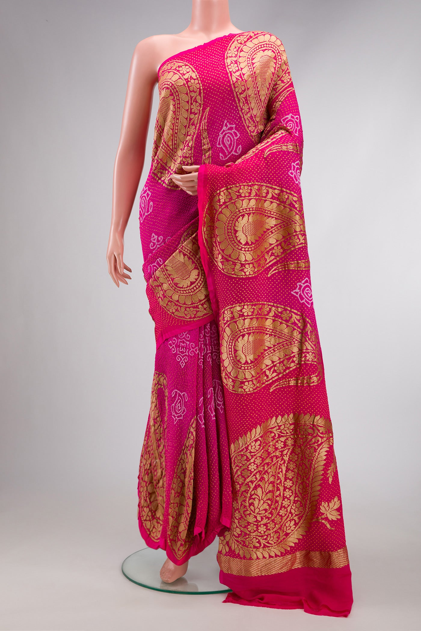 Pink Dual Tone Bandhani Silk Saree with Bandhani Print on the body and Fancy Border.  displayed on a mannequin