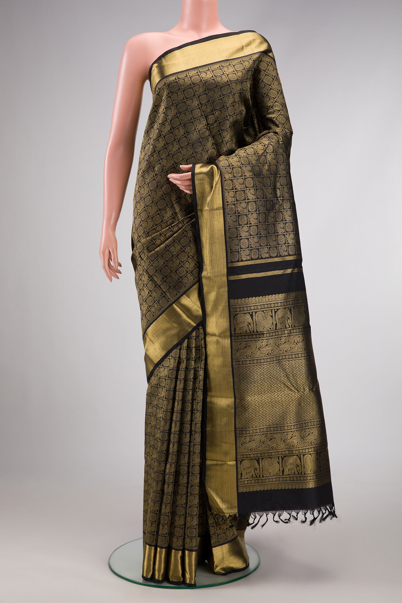 Pure Silk Pure Zari Black Dual Tone Kanjivaram Saree with Zari Brocade on the body and Zari Border.  displayed on a mannequin