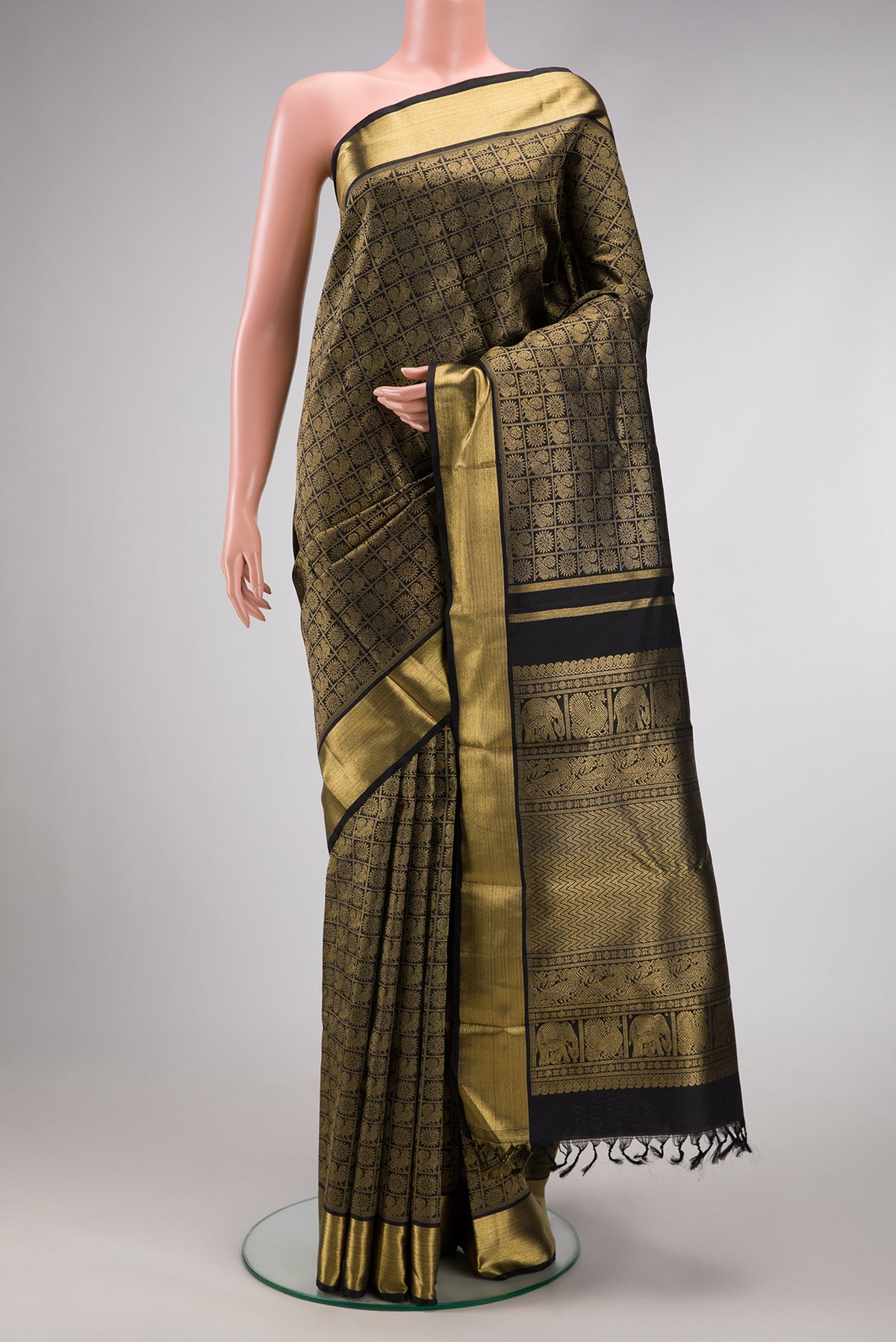 Pure Silk Pure Zari Black Dual Tone Kanjivaram Saree with Zari Brocade on the body and Zari Border.  displayed on a mannequin