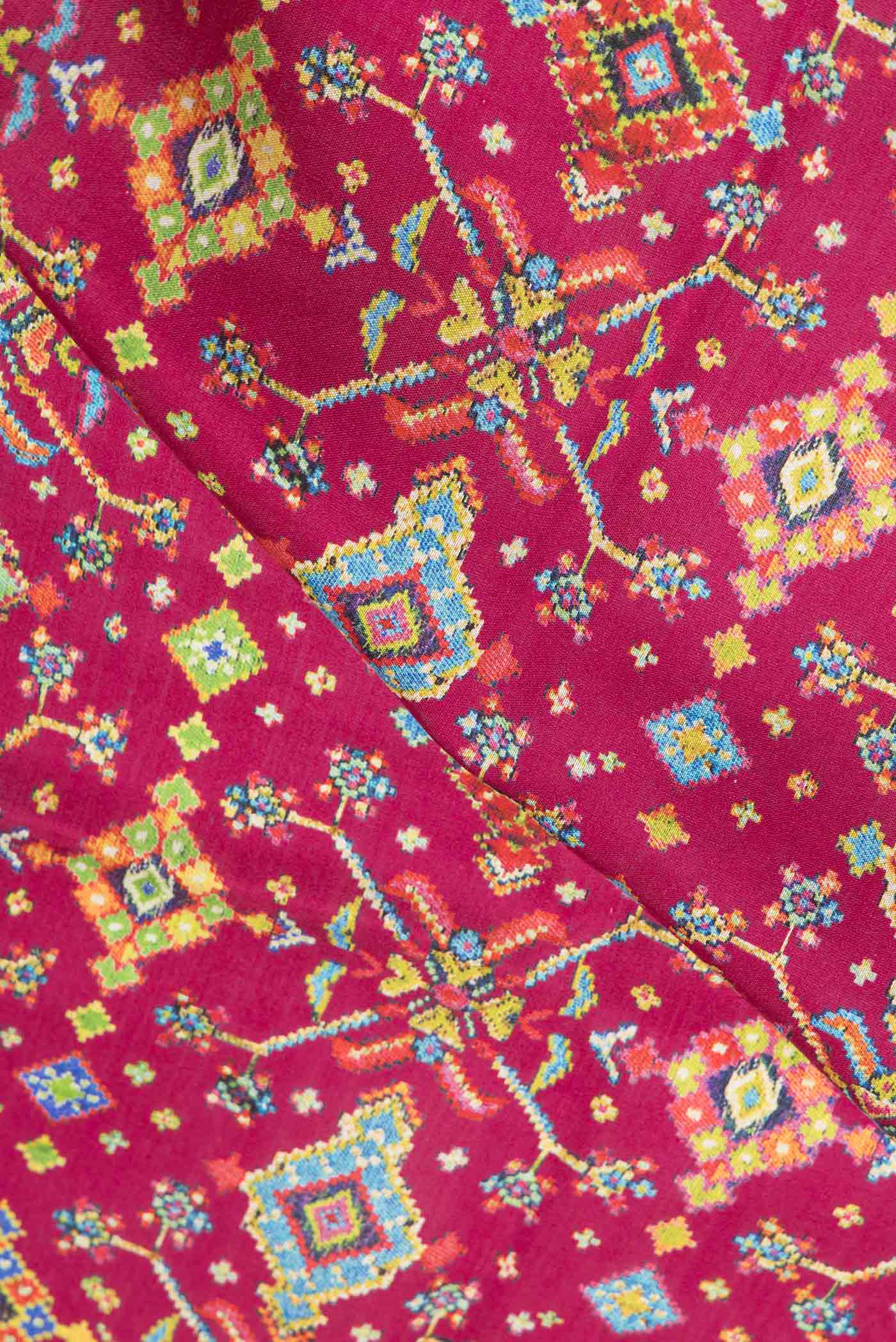 Close up of Pink Dual Tone Tussar Saree with Printed design on the body and Printed Border.  displaying folds