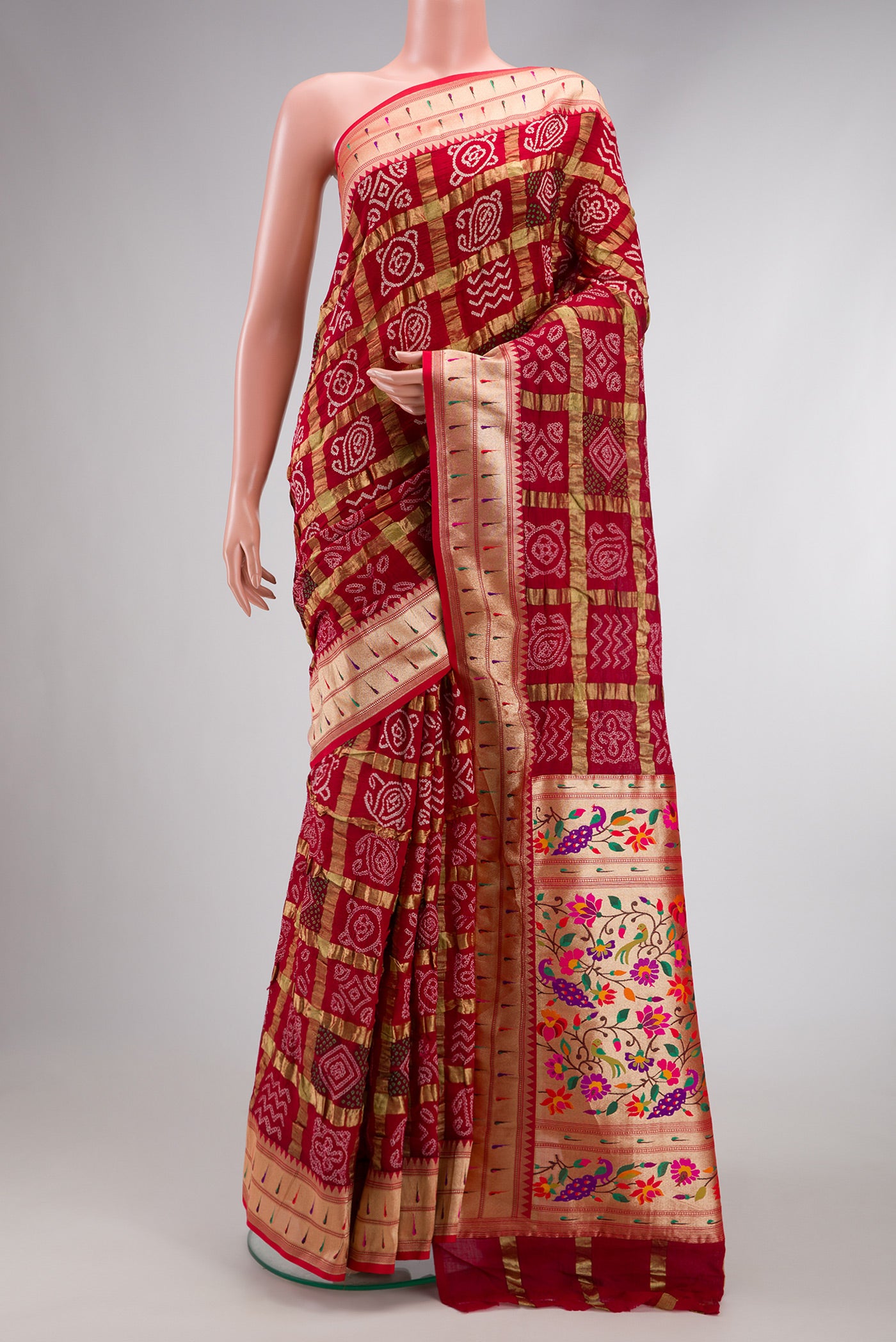 Red Dual Tone Bandhani Silk Saree with Bandhani Print on the body and Paithani Border.  displayed on a mannequin