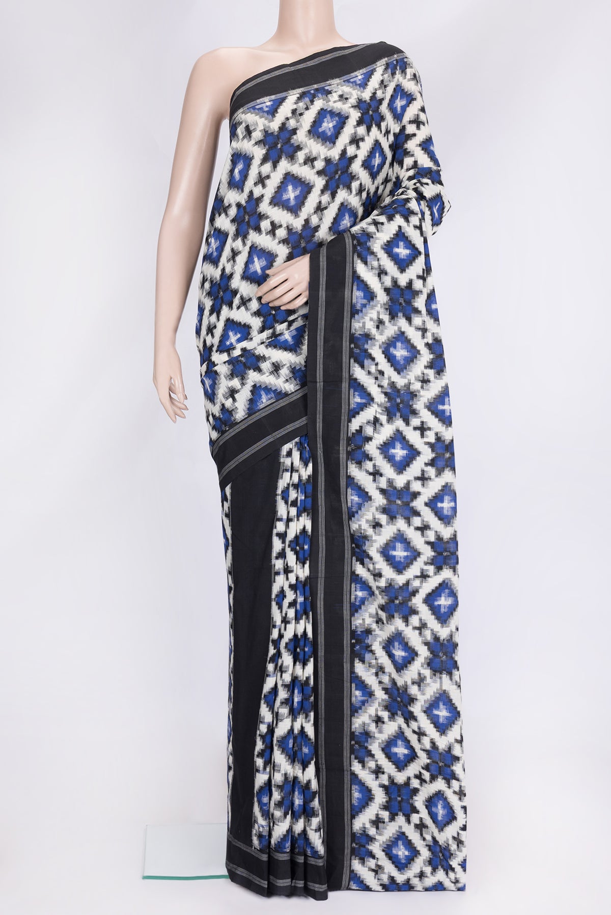 Off White Dual Tone Double Ikat Saree with Ikat Print on the body and Thread Border.  displayed on a mannequin