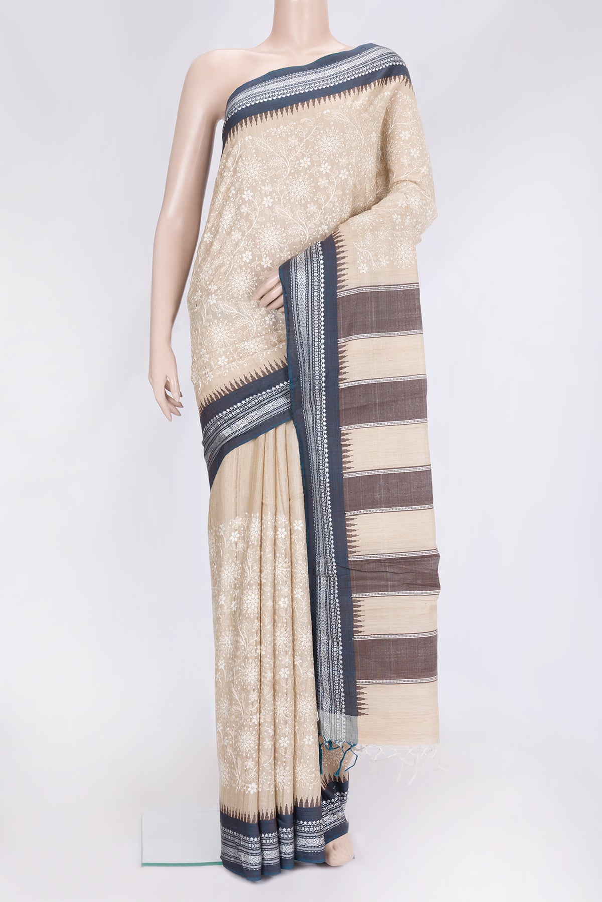 Beige Dual Tone Tussar Silk Saree with Embroidery on the body and Thread Border.  displayed on a mannequin