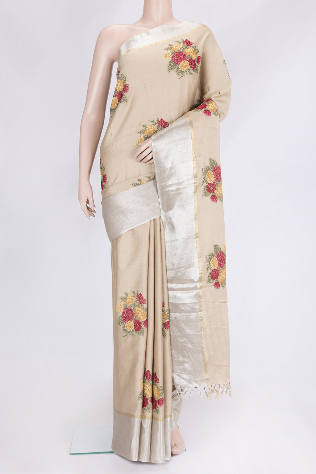 Beige Dual Tone Tussar Silk Saree with Embroidery on the body and Zari Border.  displayed on a mannequin