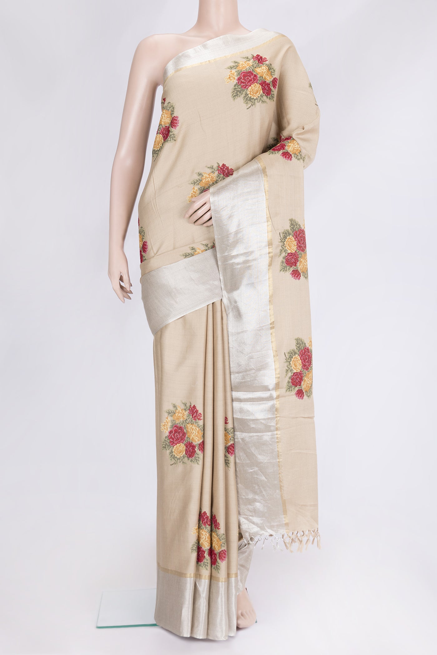 Beige Dual Tone Tussar Silk Saree with Embroidery on the body and Zari Border.  displayed on a mannequin