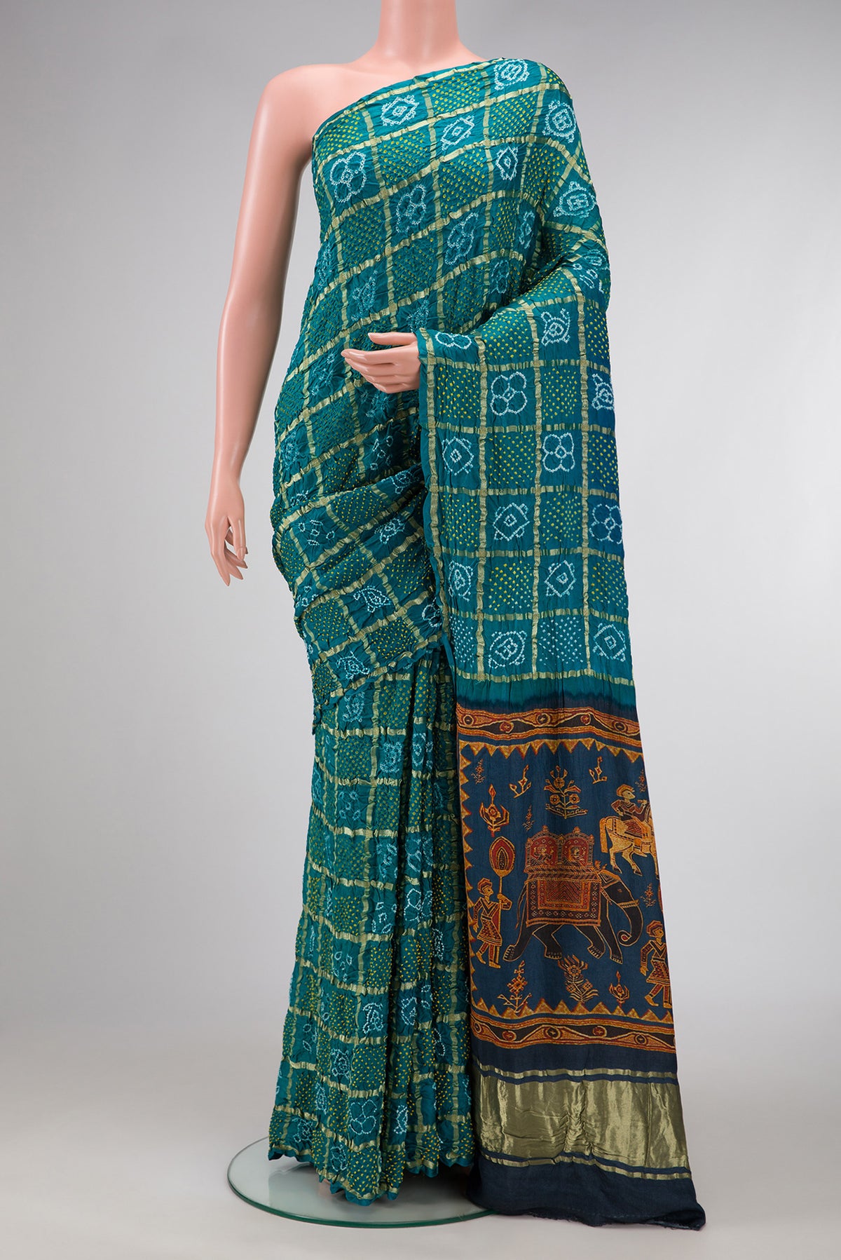 Green Dual Tone Bandhani Silk Saree with Bandhani Print on the body and Without Border.  displayed on a mannequin