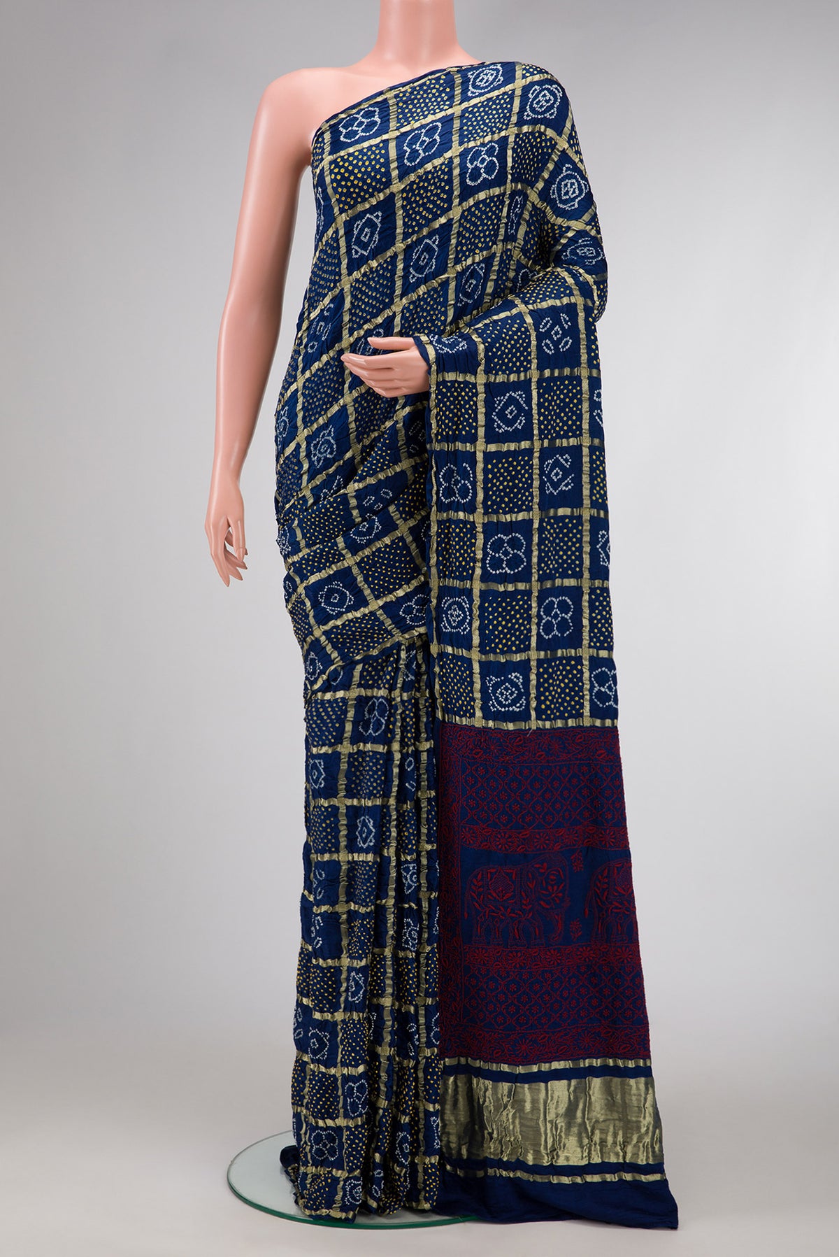 Navy Blue Dual Tone Bandhani Silk Saree with Bandhani Print on the body and Without Border.  displayed on a mannequin