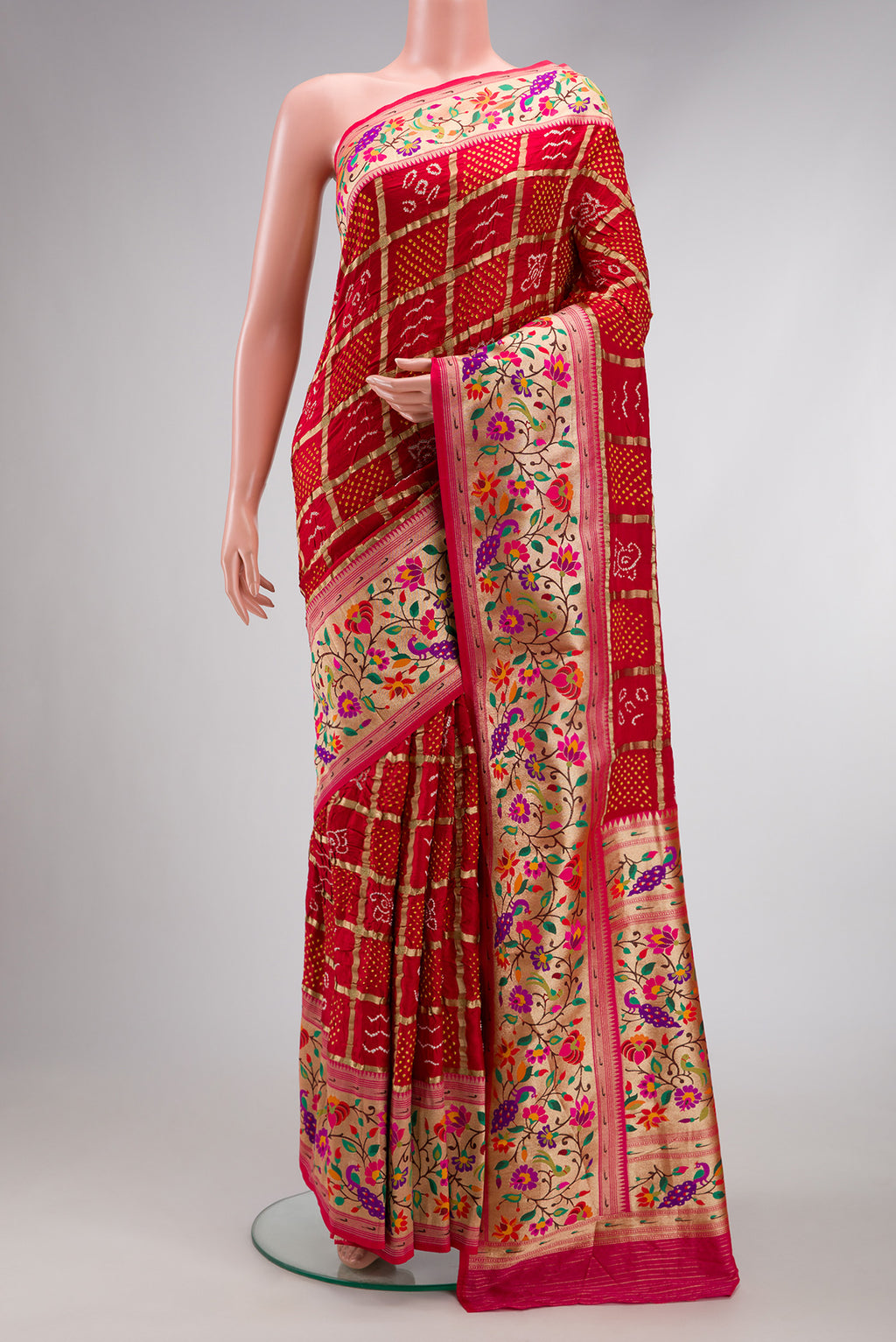 Red Dual Tone Bandhani Silk Saree with Bandhani Print on the body and Fancy Border.  displayed on a mannequin