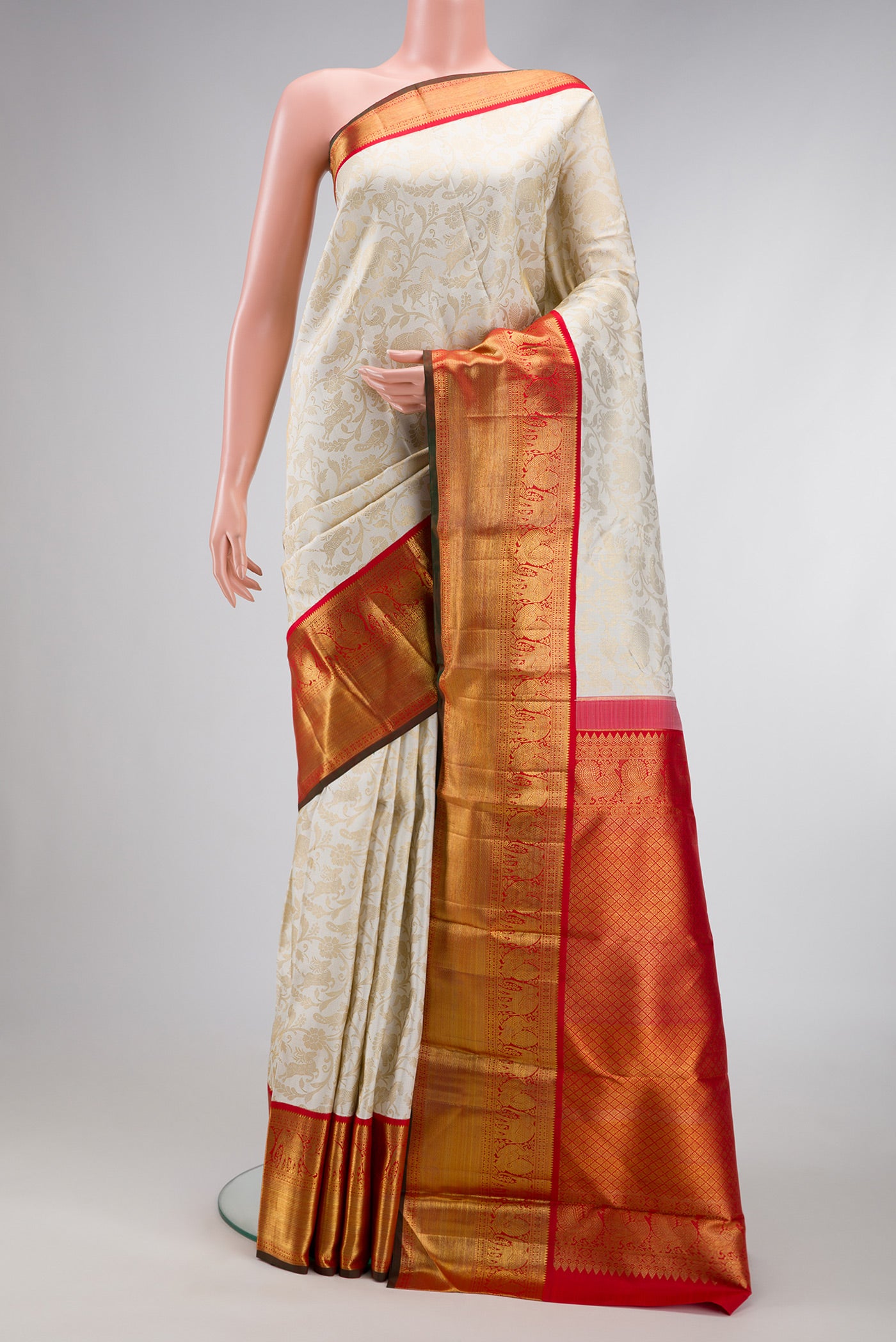 Off White Dual Tone Kanchipuram Silk Saree with Zari Brocade on the body and Zari Border.  displayed on a mannequin