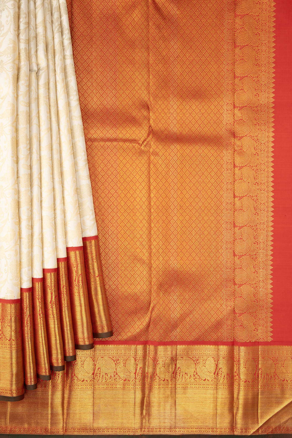 Pleats and pallu of Off White Dual Tone Kanchipuram Silk Saree with Zari Brocade on the body and Zari Border. 