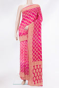 Pink Bandhani Georgette Saree with Zari Brocade on the body and Zari Border.  displayed on a mannequin