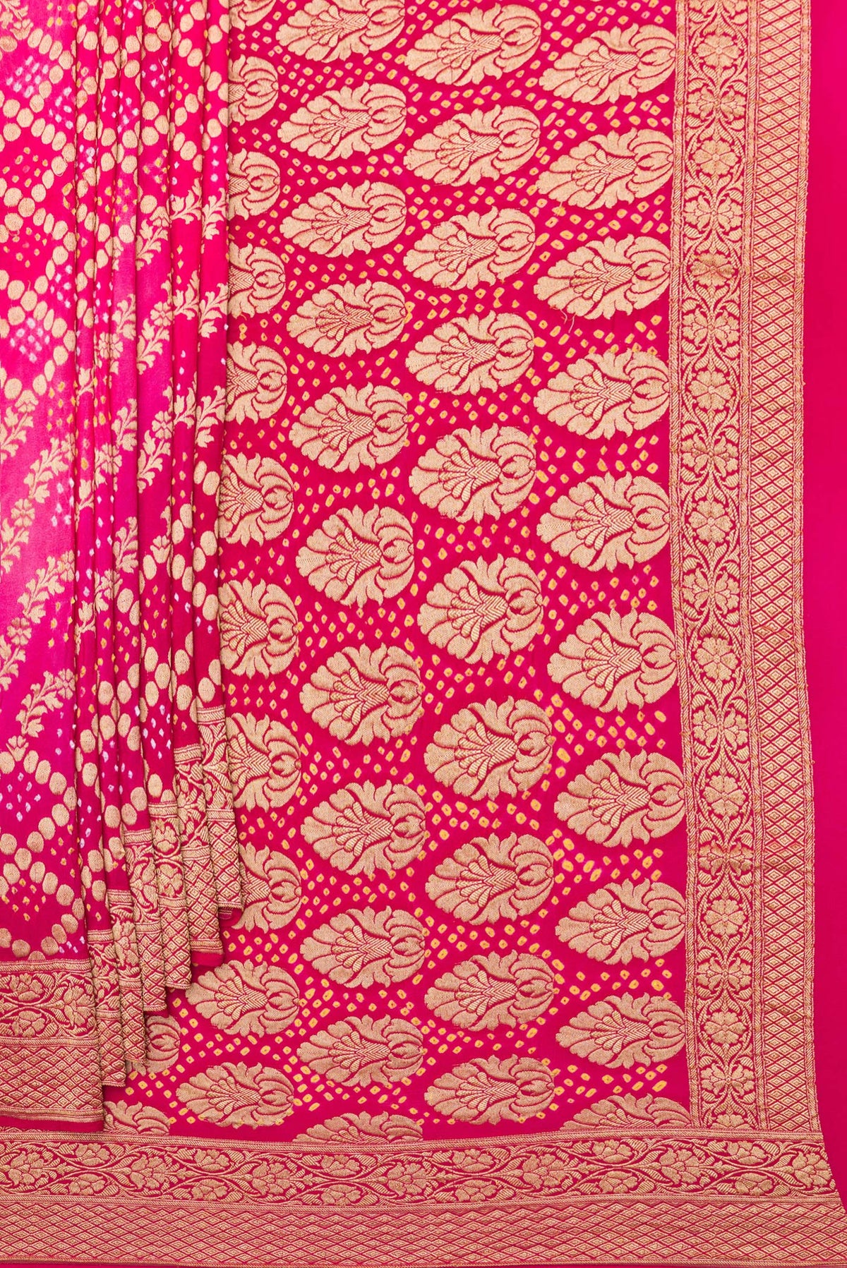 Pleats and pallu of Pink Bandhani Georgette Saree with Zari Brocade on the body and Zari Border. 