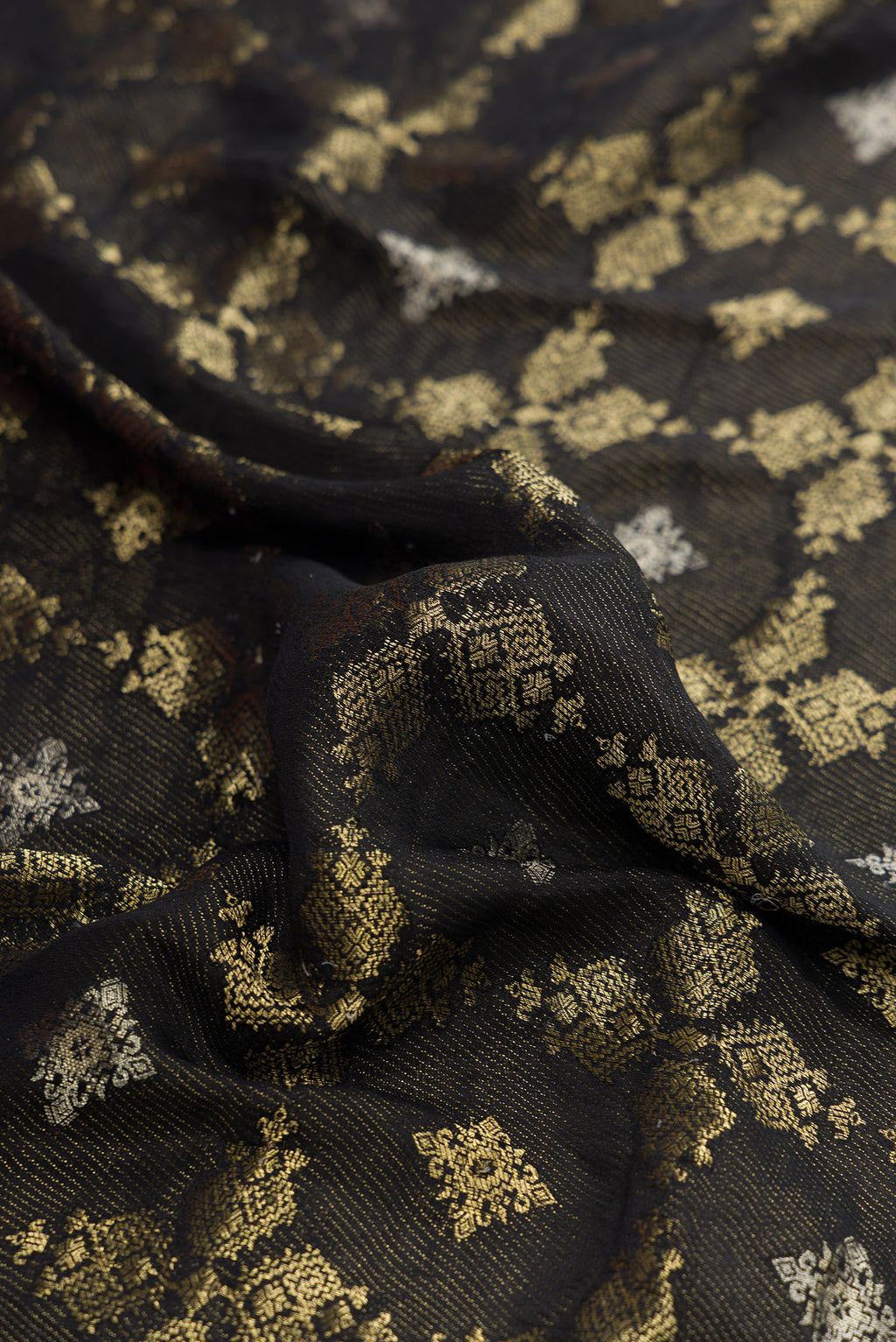 Close up of Black Dual Tone Mysore Georgette Saree with Zari Brocade on the body and Zari Border.  displaying folds
