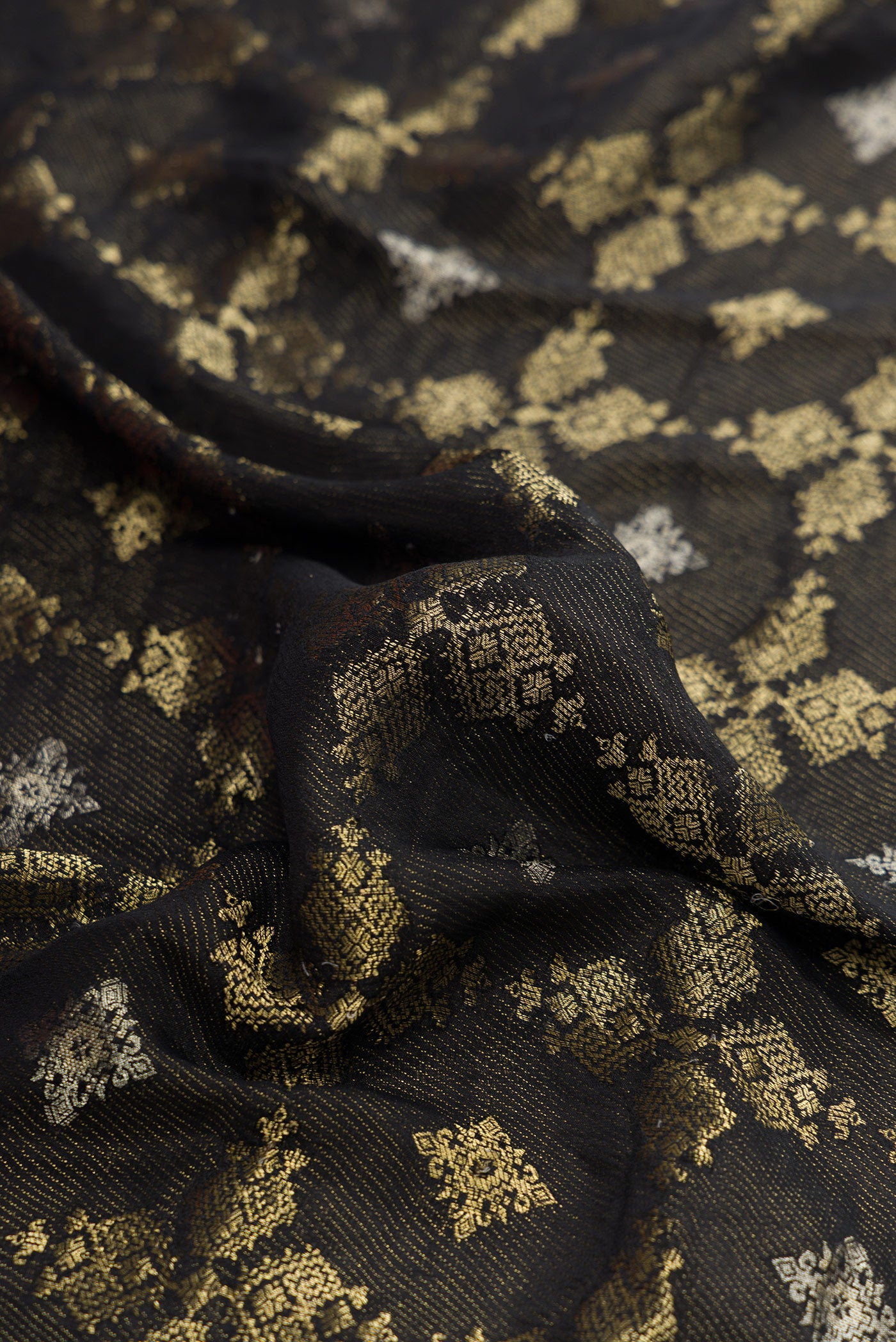 Close up of Black Dual Tone Mysore Georgette Saree with Zari Brocade on the body and Zari Border.  displaying folds