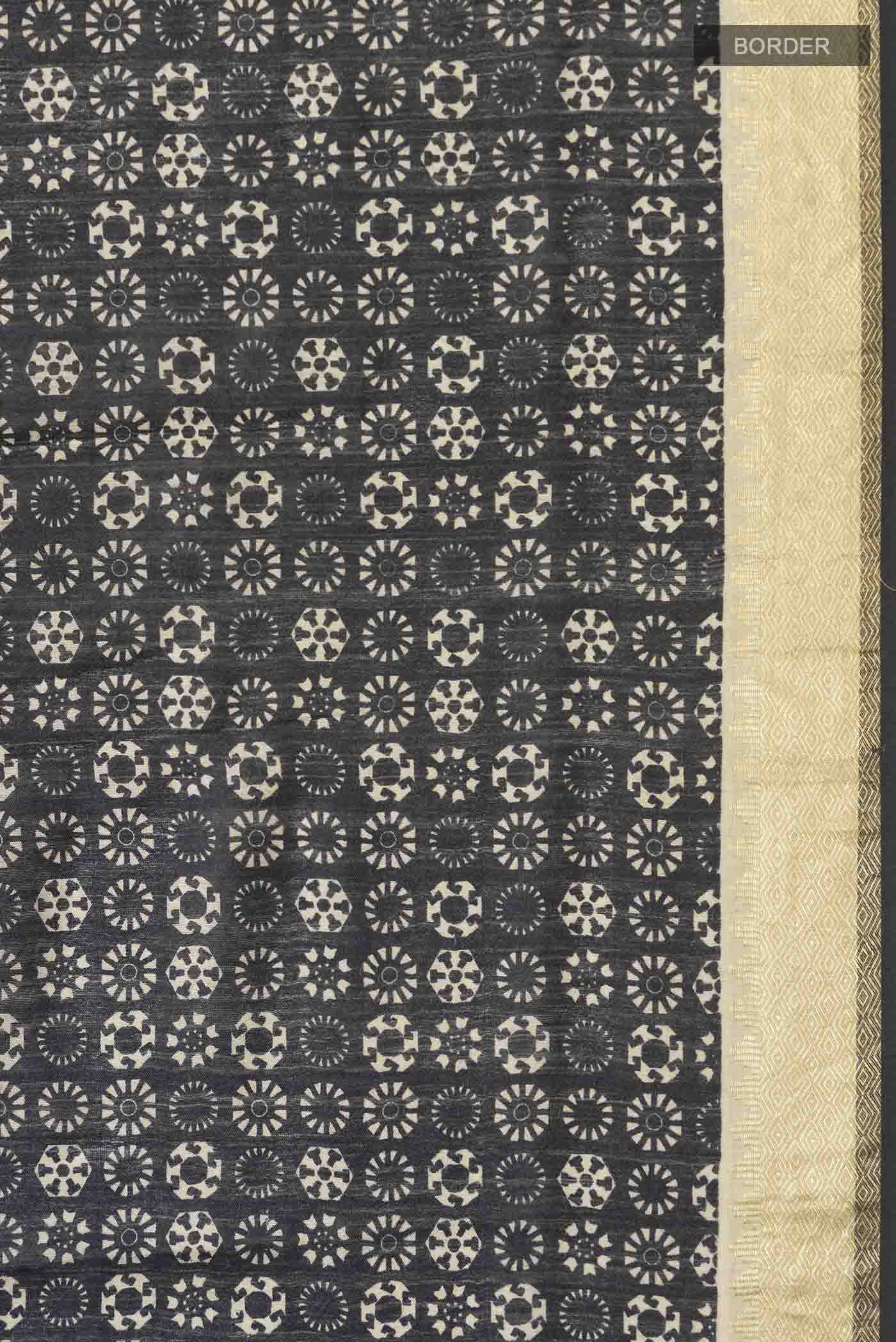 Border image of Black Tussar Silk Saree with Printed design on the body and Zari Border