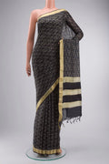 Black Tussar Silk Saree with Printed design on the body and Zari Border displayed on a mannequin