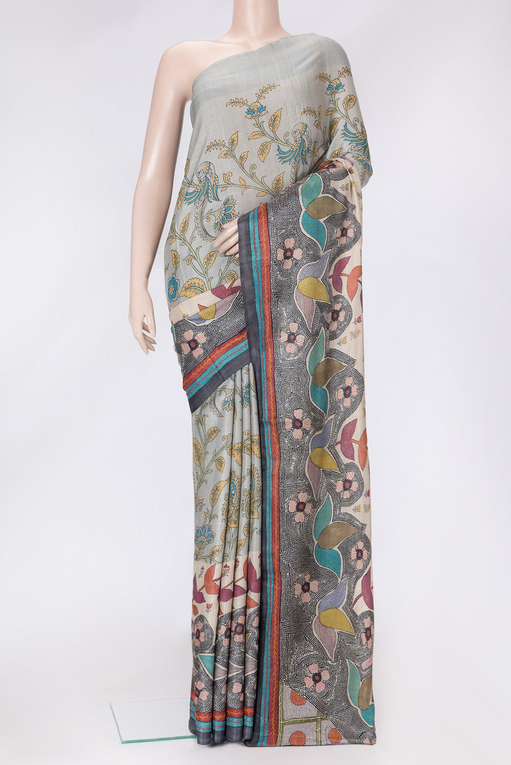 Grey Dual Tone Tussar Silk Saree with Printed design on the body and Embroidery Border.  displayed on a mannequin