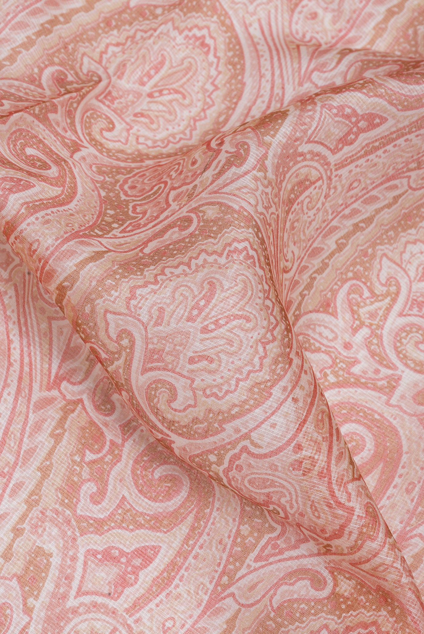 Close up of Pink Kota Silk Saree with Printed design on the body and Zari Border.  displaying folds