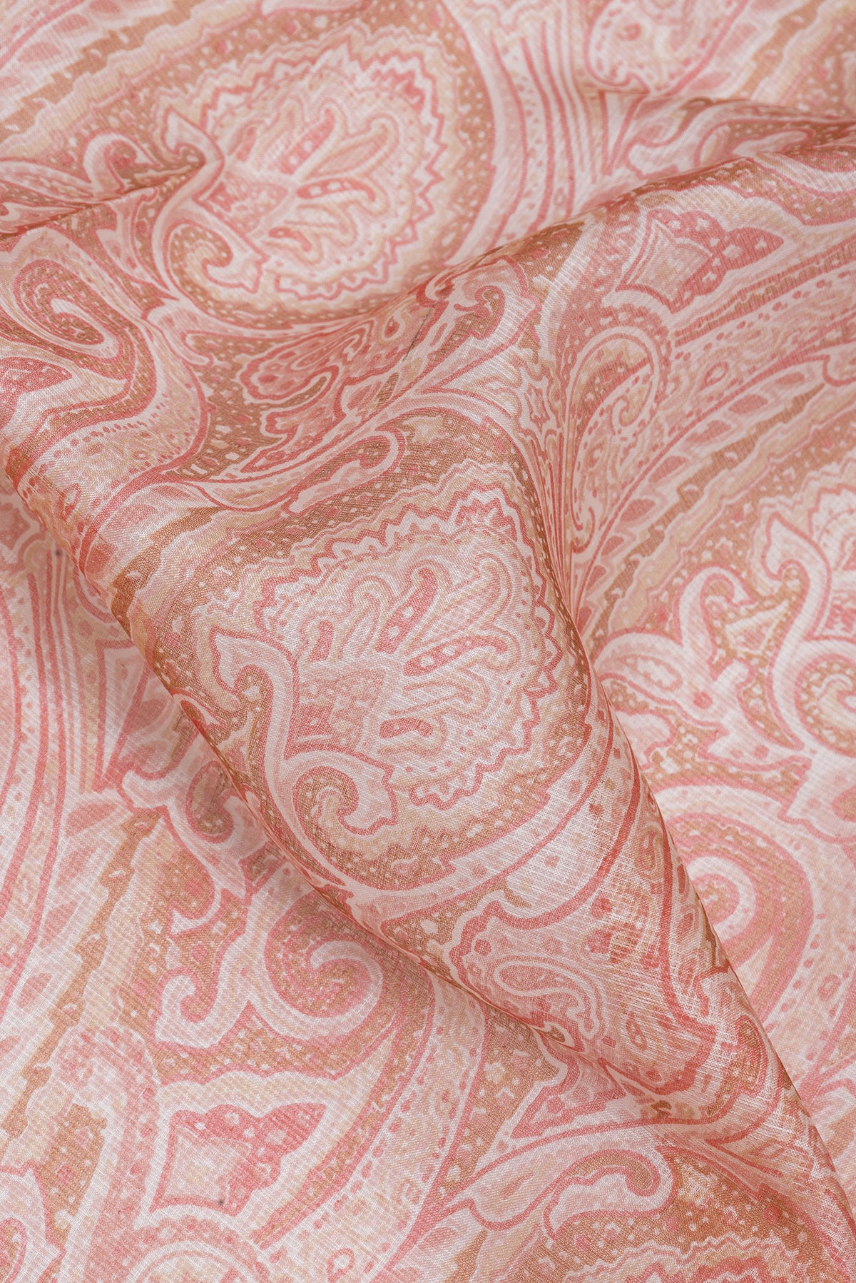 Close up of Pink Kota Silk Saree with Printed design on the body and Zari Border.  displaying folds