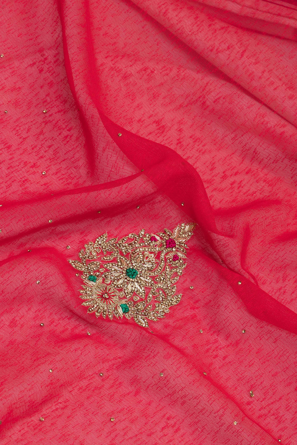 Close up of Red Linen Saree with Embroidery on the body and Fancy Border.  displaying folds