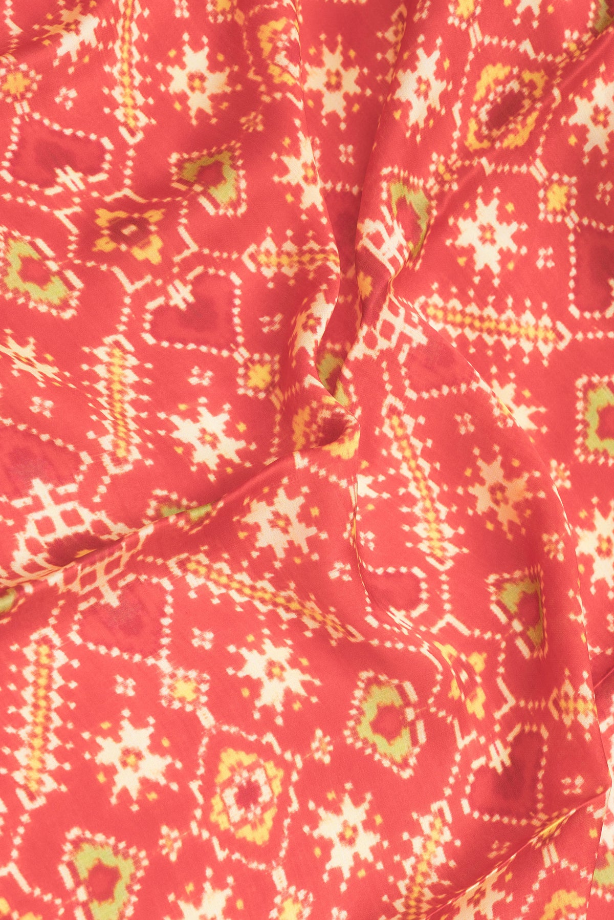 Close up of Red Dual Tone Mysore Crepe Saree with Printed design on the body and Printed Border.  displaying folds