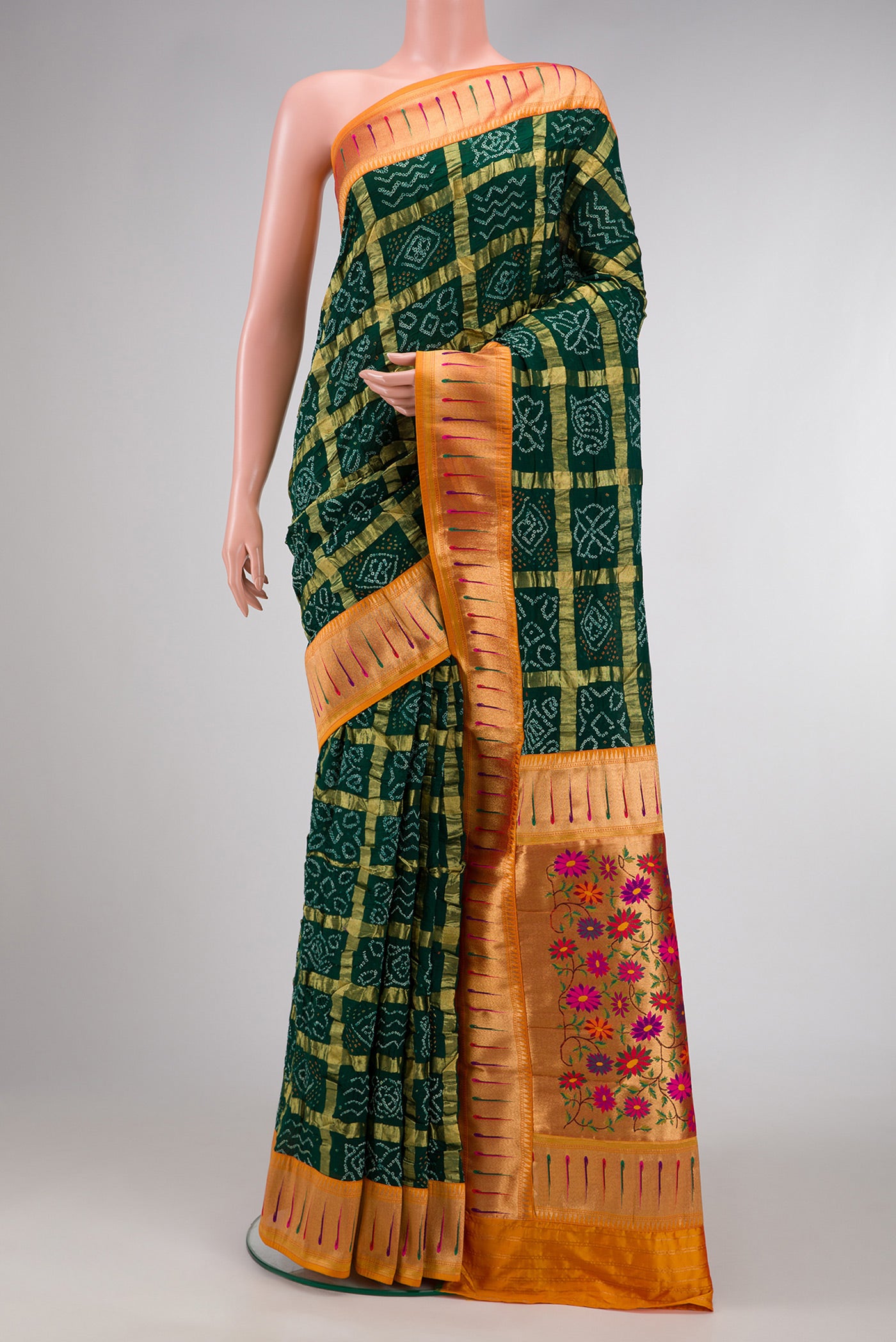 Bottle Green Dual Tone Bandhani Silk Saree with Bandhani Print on the body and Paithani Border.  displayed on a mannequin