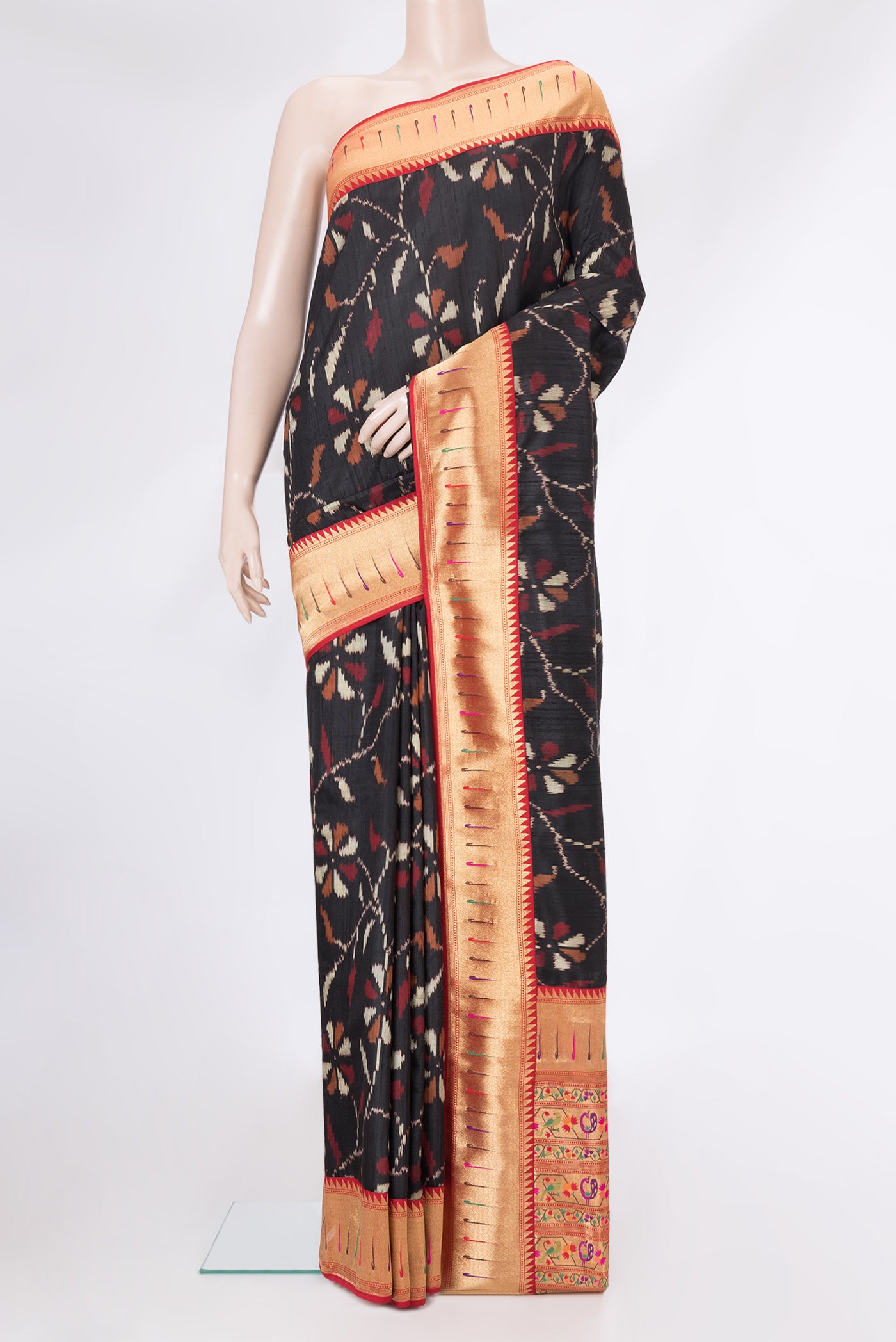 Black Dual Tone Double Ikat Saree with Ikat Print on the body and Paithani Border.  displayed on a mannequin