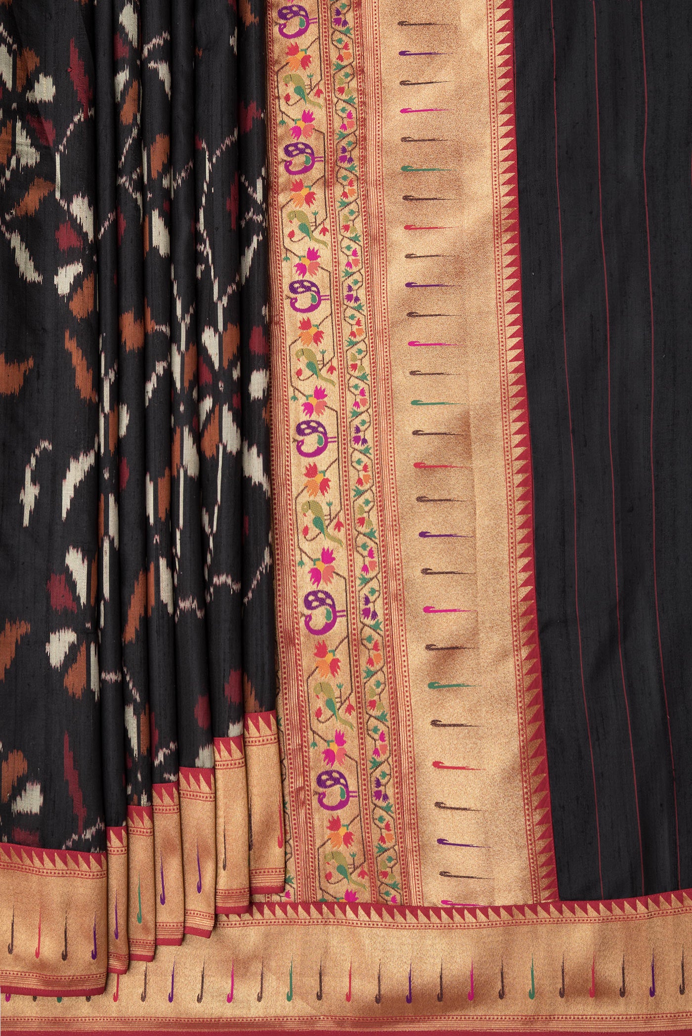Pleats and pallu of Black Dual Tone Double Ikat Saree with Ikat Print on the body and Paithani Border. 