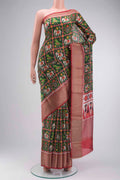 Green Tussar Silk Saree with Printed design on the body and Zari Border displayed on a mannequin