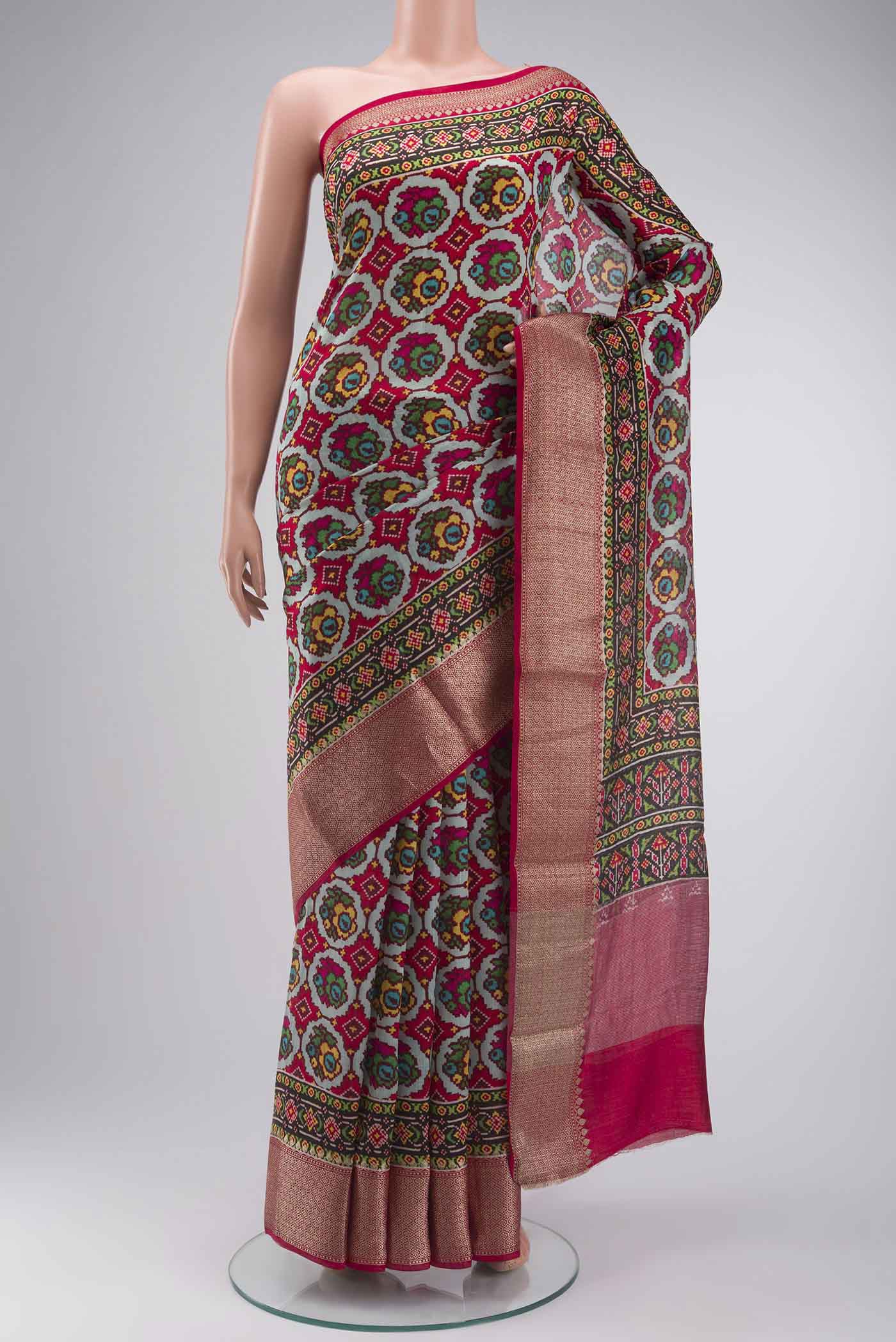 Grey Bhagalpuri Tussar Silk Saree with Printed design on the body and Zari Border displayed on a mannequin