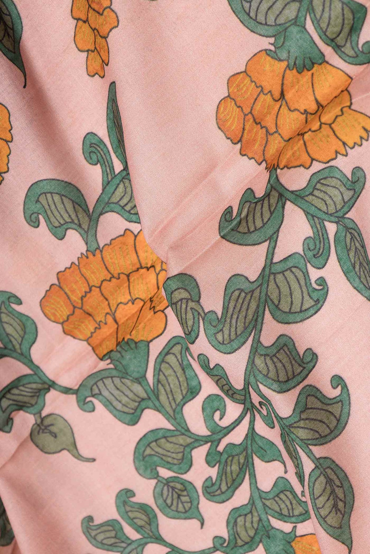 Close up of Pink Dual Tone Tussar Saree with kalamkari Print on the body and Thread Border displaying folds