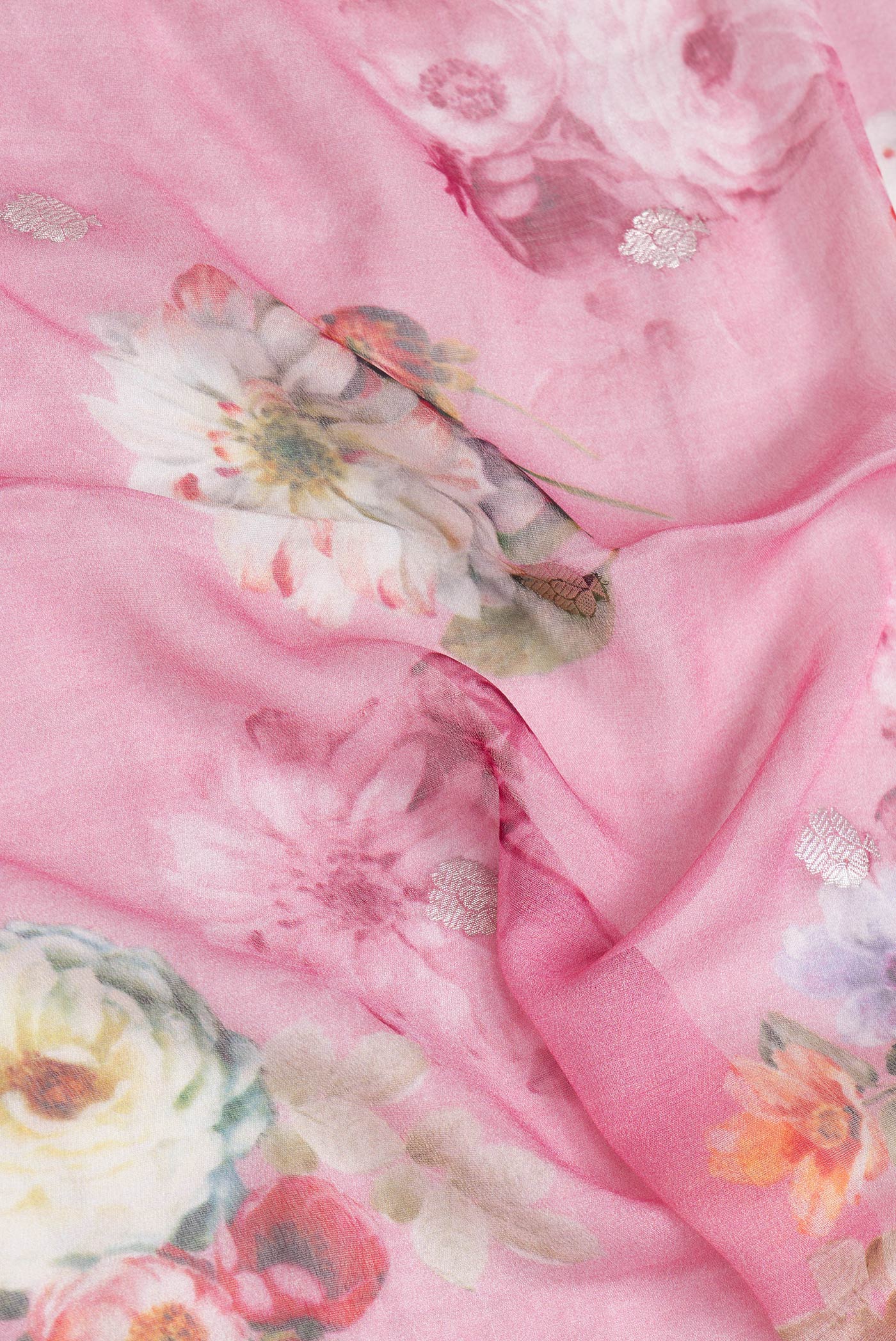 Close up of Pink Dual Tone Mysore Georgette Saree with Printed design on the body and Zari Border.  displaying folds