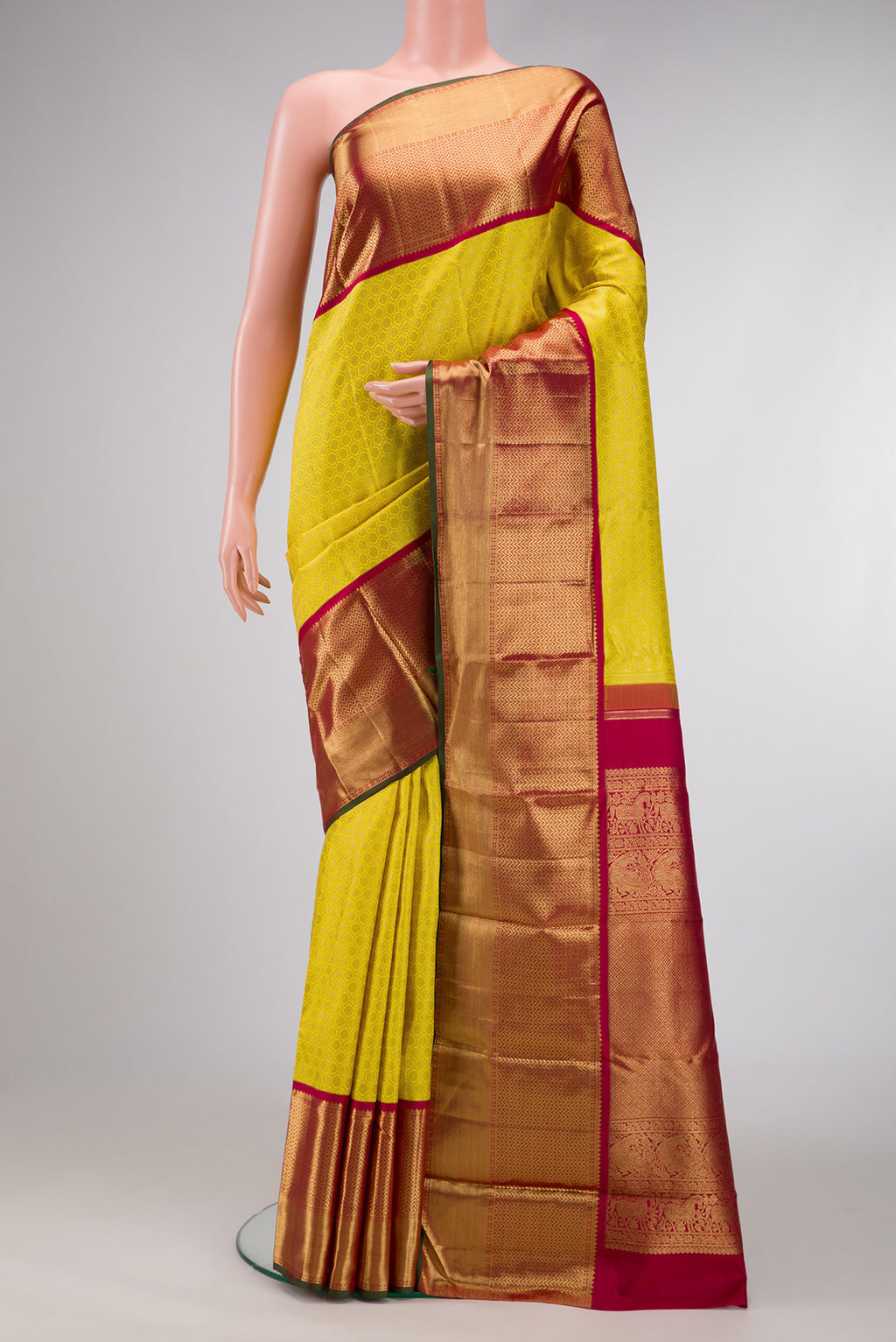 Pure Silk Pure Zari Parrot Green Dual Tone Kanjivaram Saree with Zari Brocade on the body and Zari Border.  displayed on a mannequin
