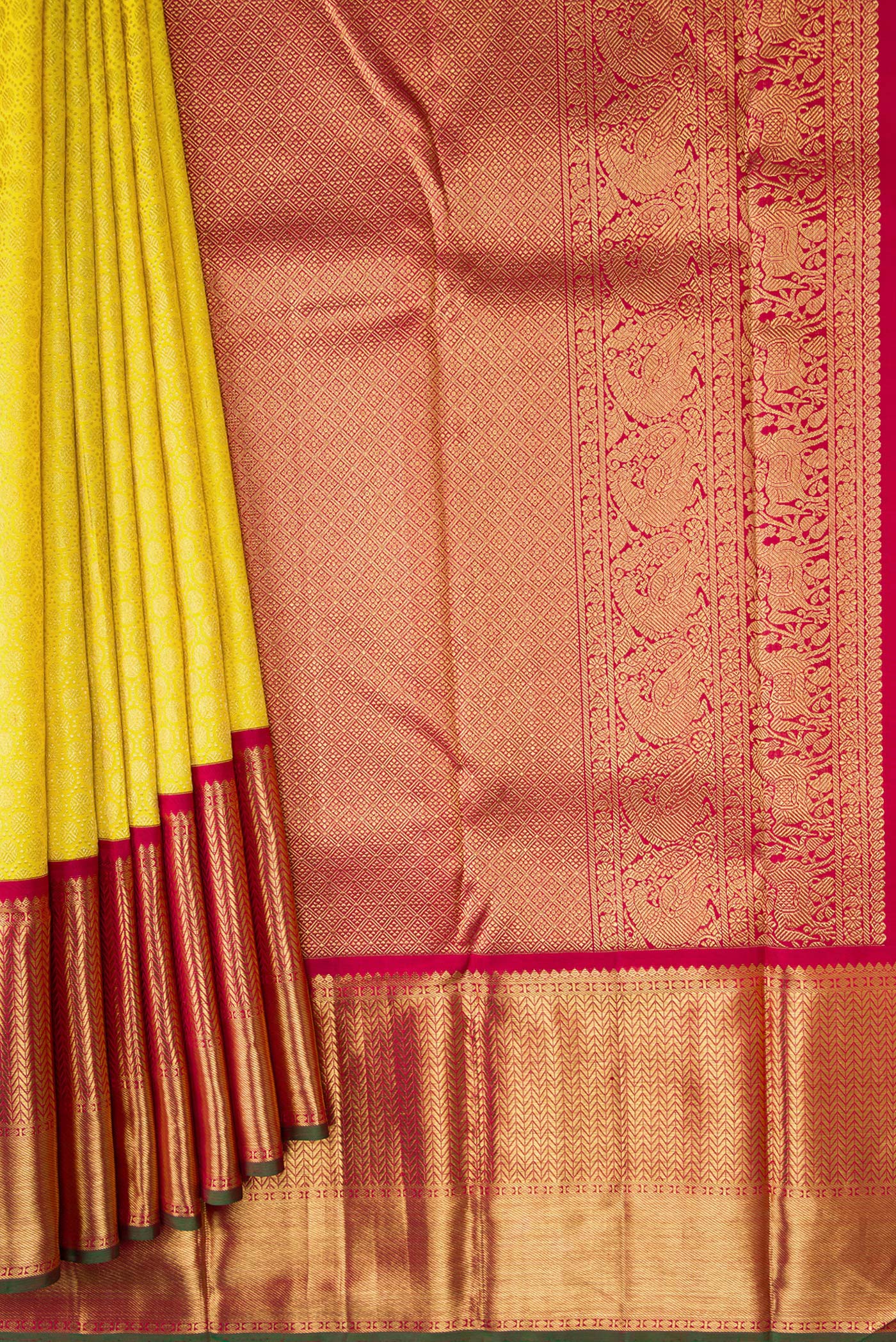 Pleats and pallu of Pure Silk Pure Zari Parrot Green Dual Tone Kanjivaram Saree with Zari Brocade on the body and Zari Border. 