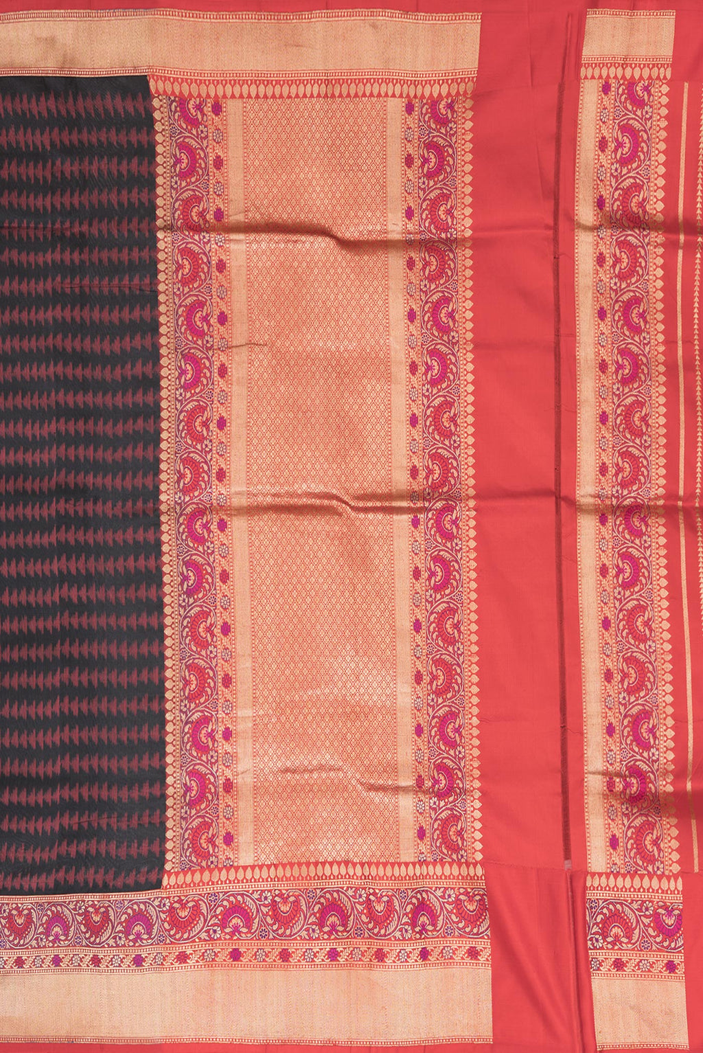 Close up image of the pallu of Black Dual Tone Double Ikat Saree with Ikat Print on the body and Fancy Border. 