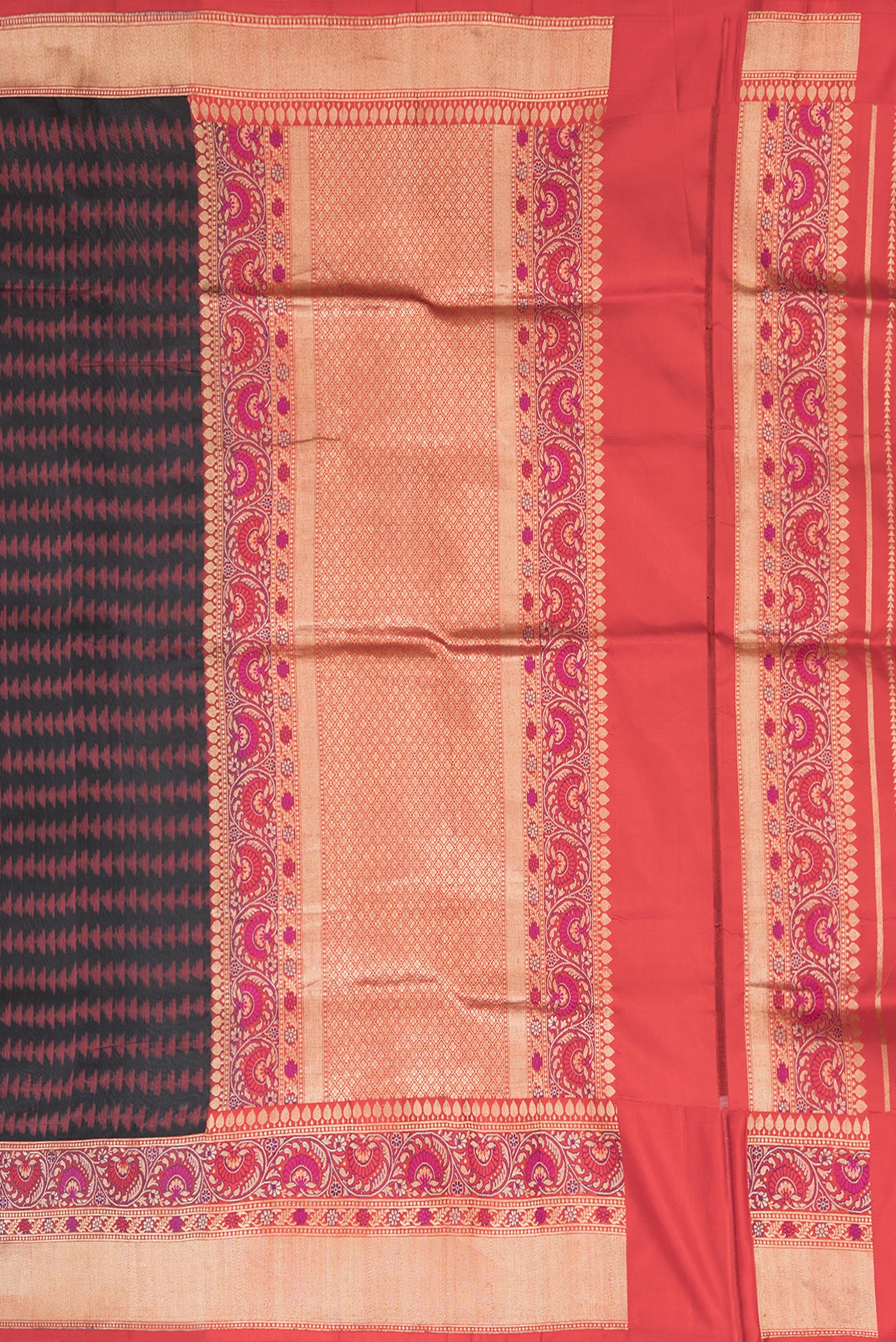 Close up image of the pallu of Black Dual Tone Double Ikat Saree with Ikat Print on the body and Fancy Border. 