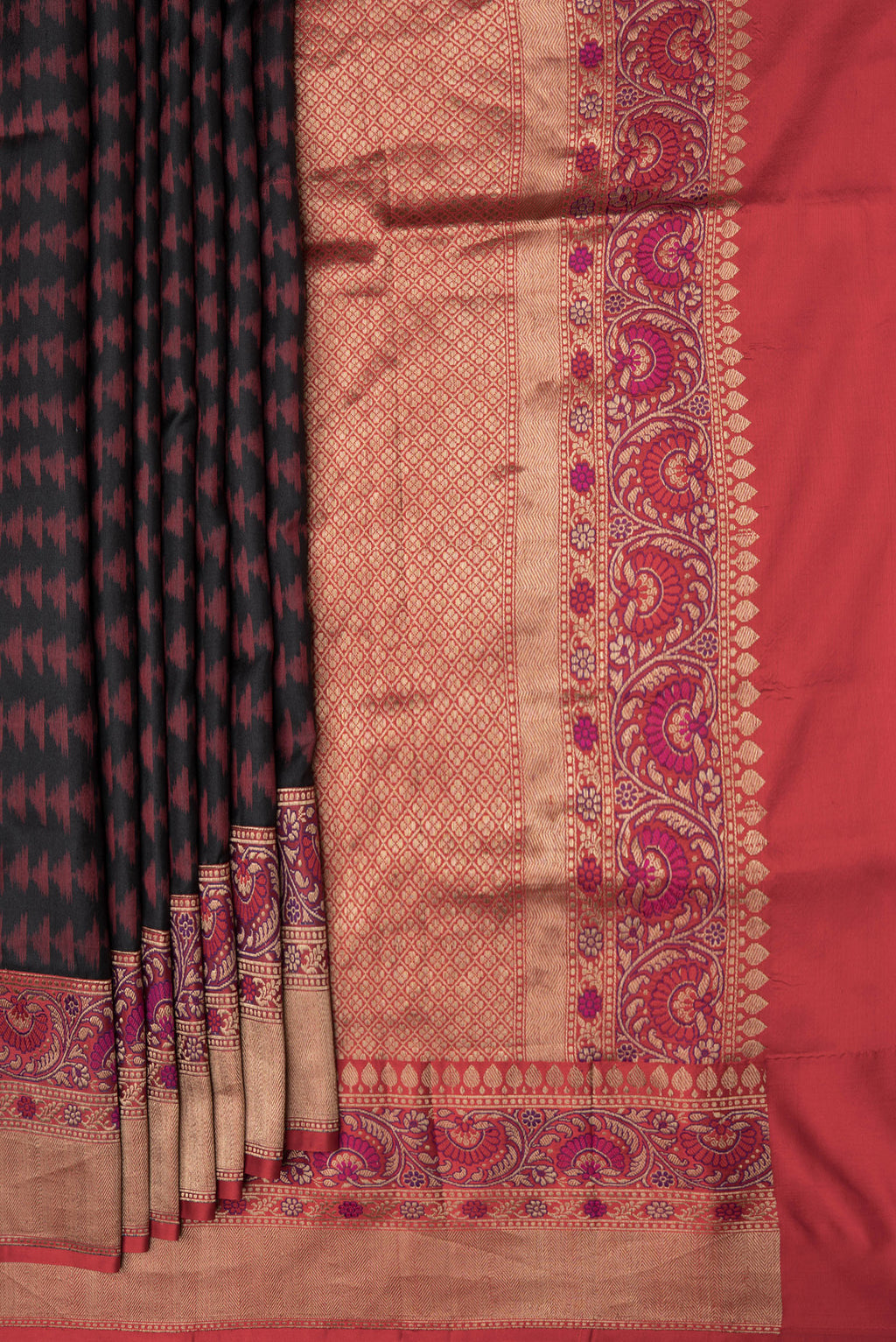 Pleats and pallu of Black Dual Tone Double Ikat Saree with Ikat Print on the body and Fancy Border. 