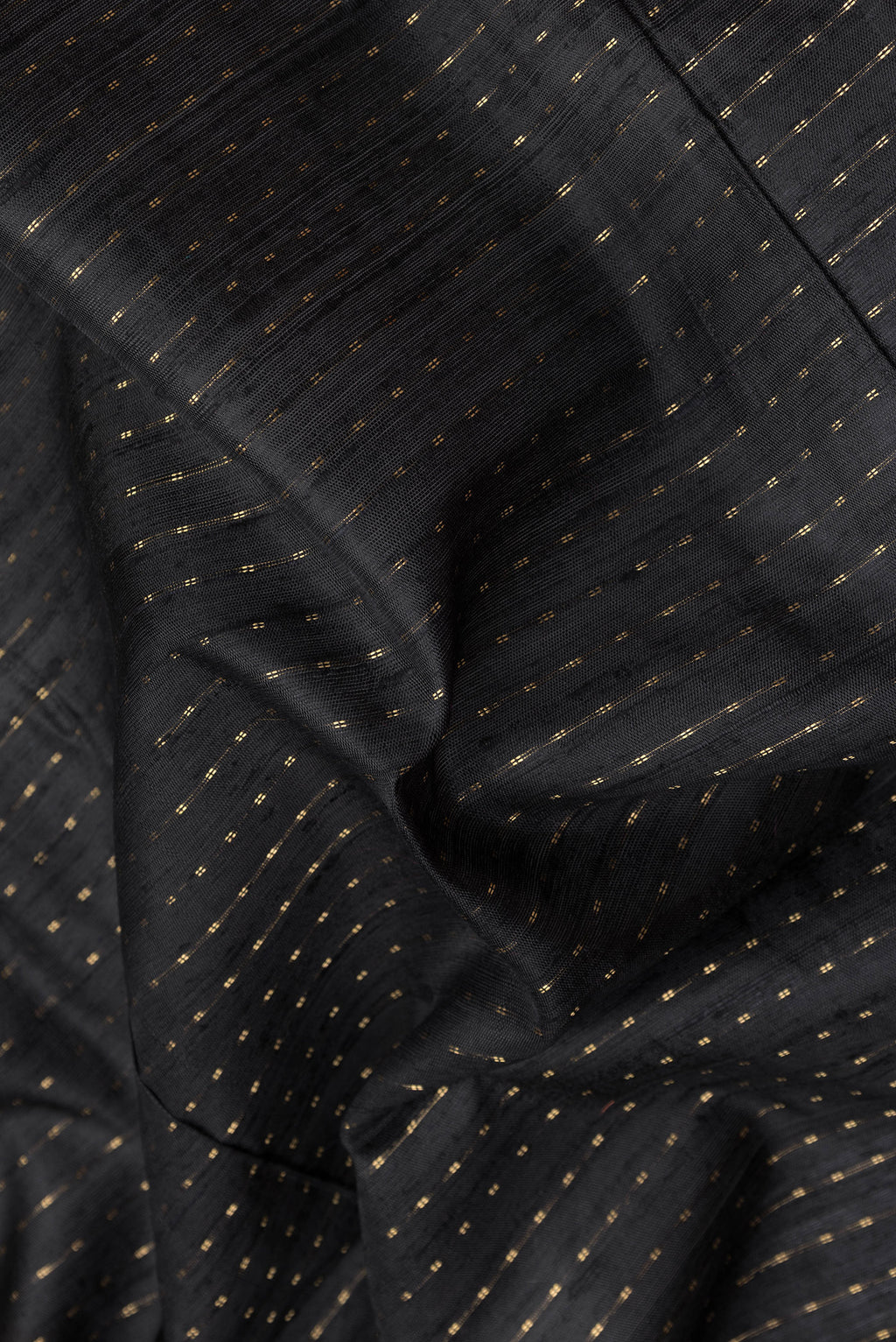 Close up of Black Tussar Silk Saree with Stripes on the body and Paithani Border.  displaying folds