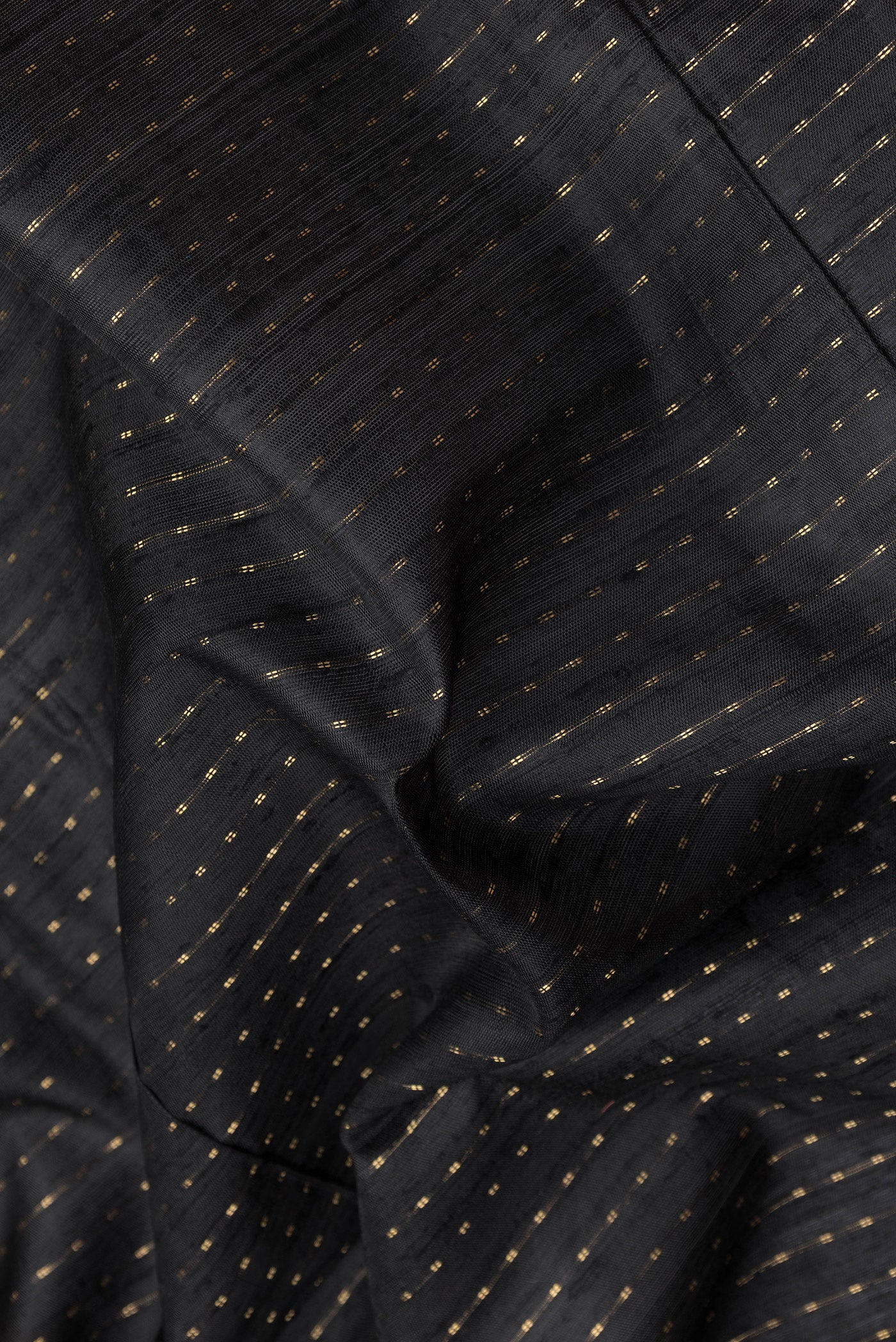 Close up of Black Tussar Silk Saree with Stripes on the body and Paithani Border.  displaying folds