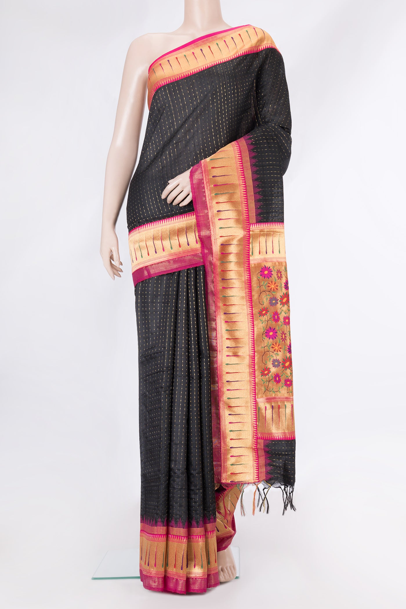 Black Tussar Silk Saree with Stripes on the body and Paithani Border.  displayed on a mannequin