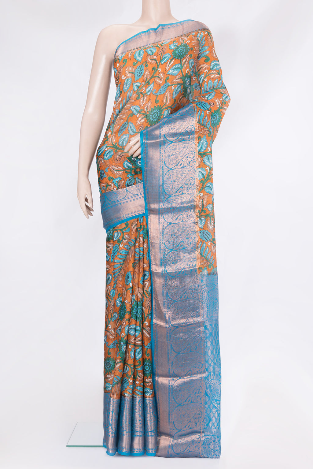 Orange Kota Silk Saree with Printed design on the body and Zari Border.  displayed on a mannequin